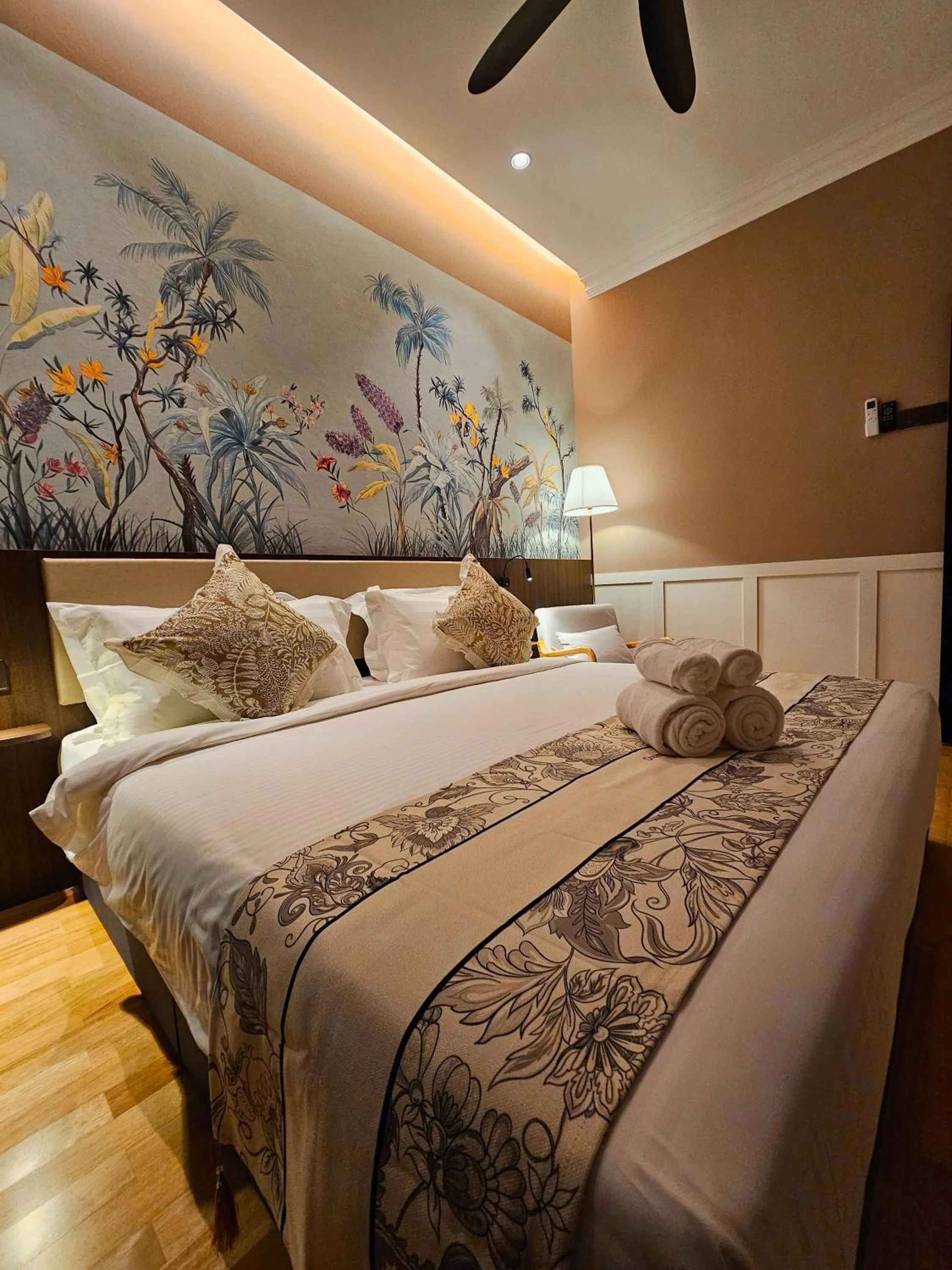 Bed in The Palm Suite at Lava Mansion