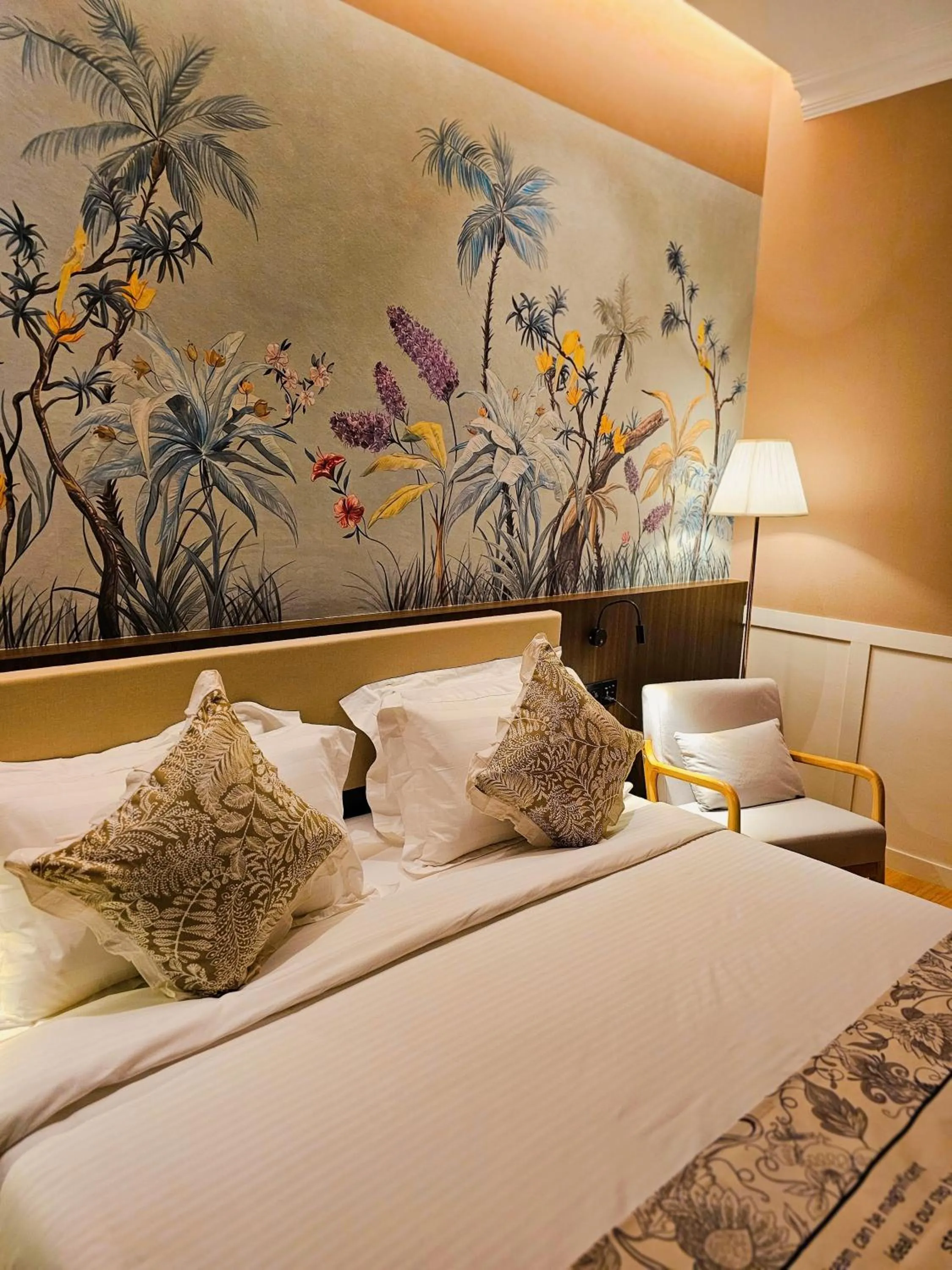 Bed in The Palm Suite at Lava Mansion