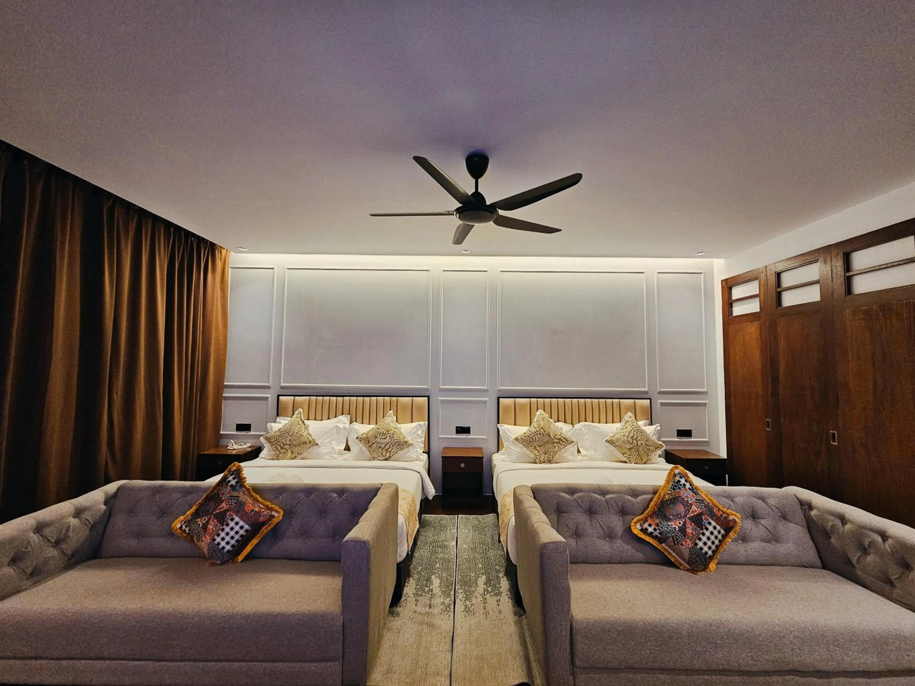 Bed in The Palm Suite at Lava Mansion