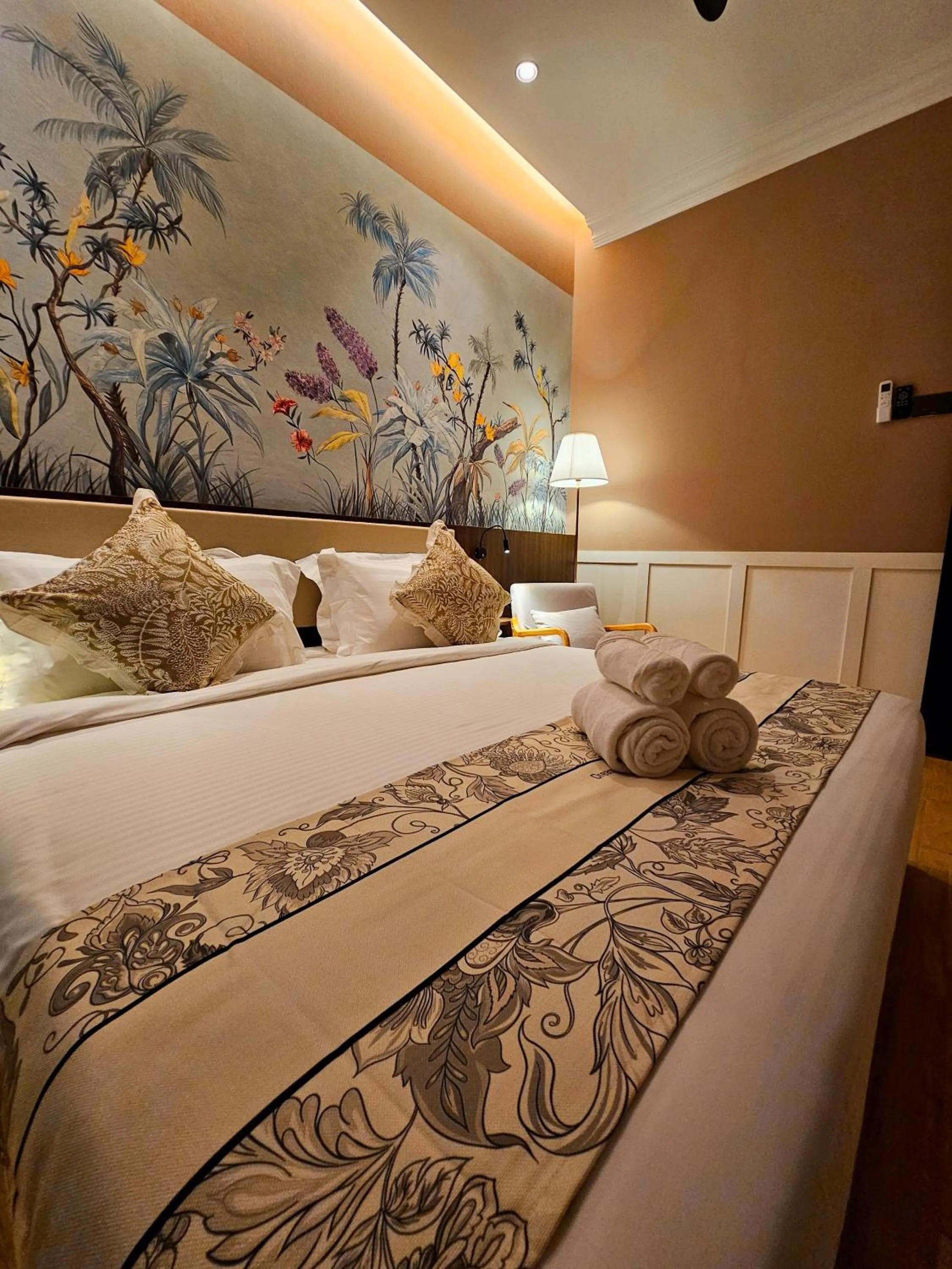 Bed in The Palm Suite at Lava Mansion