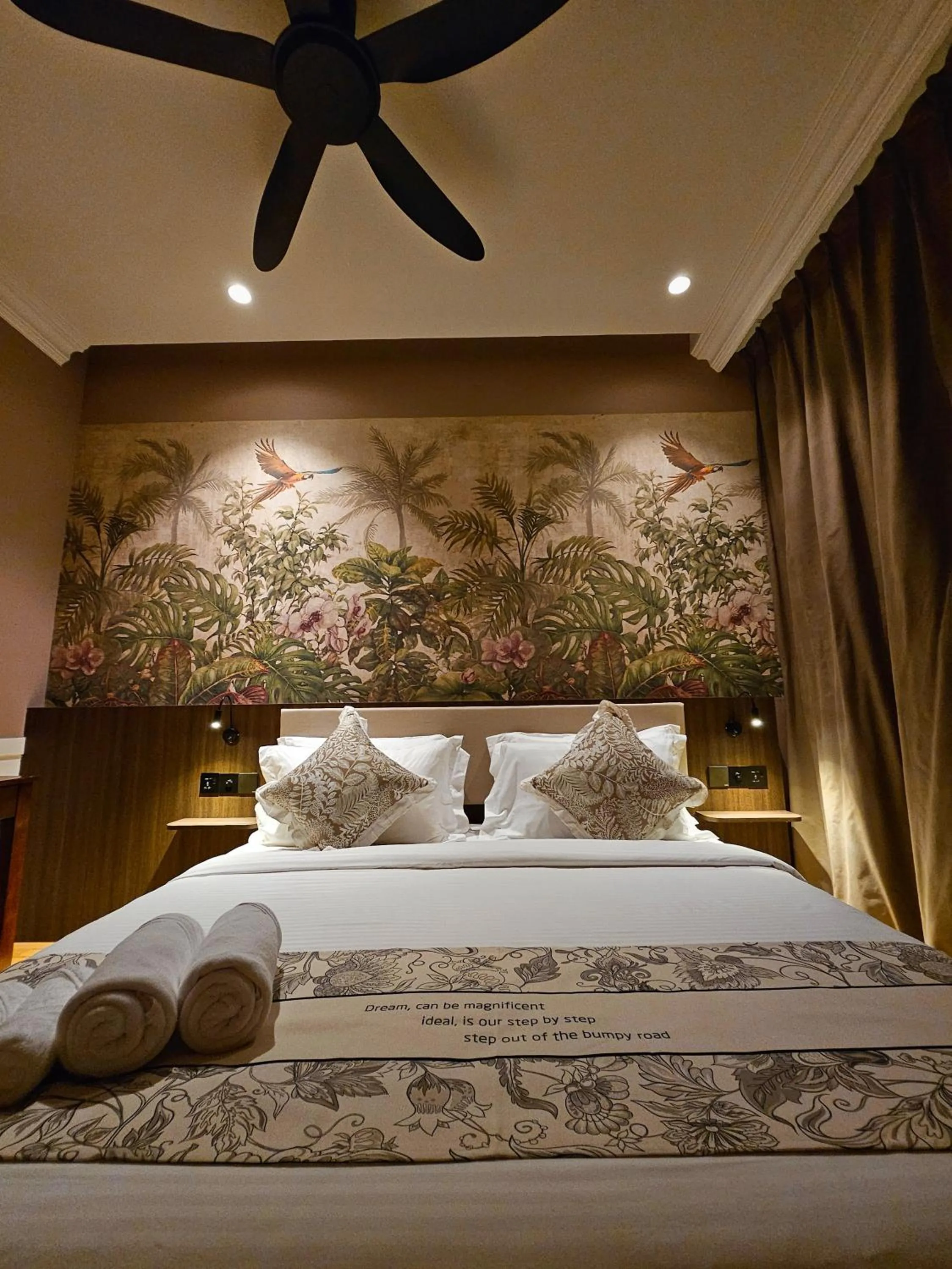 Bed in The Palm Suite at Lava Mansion