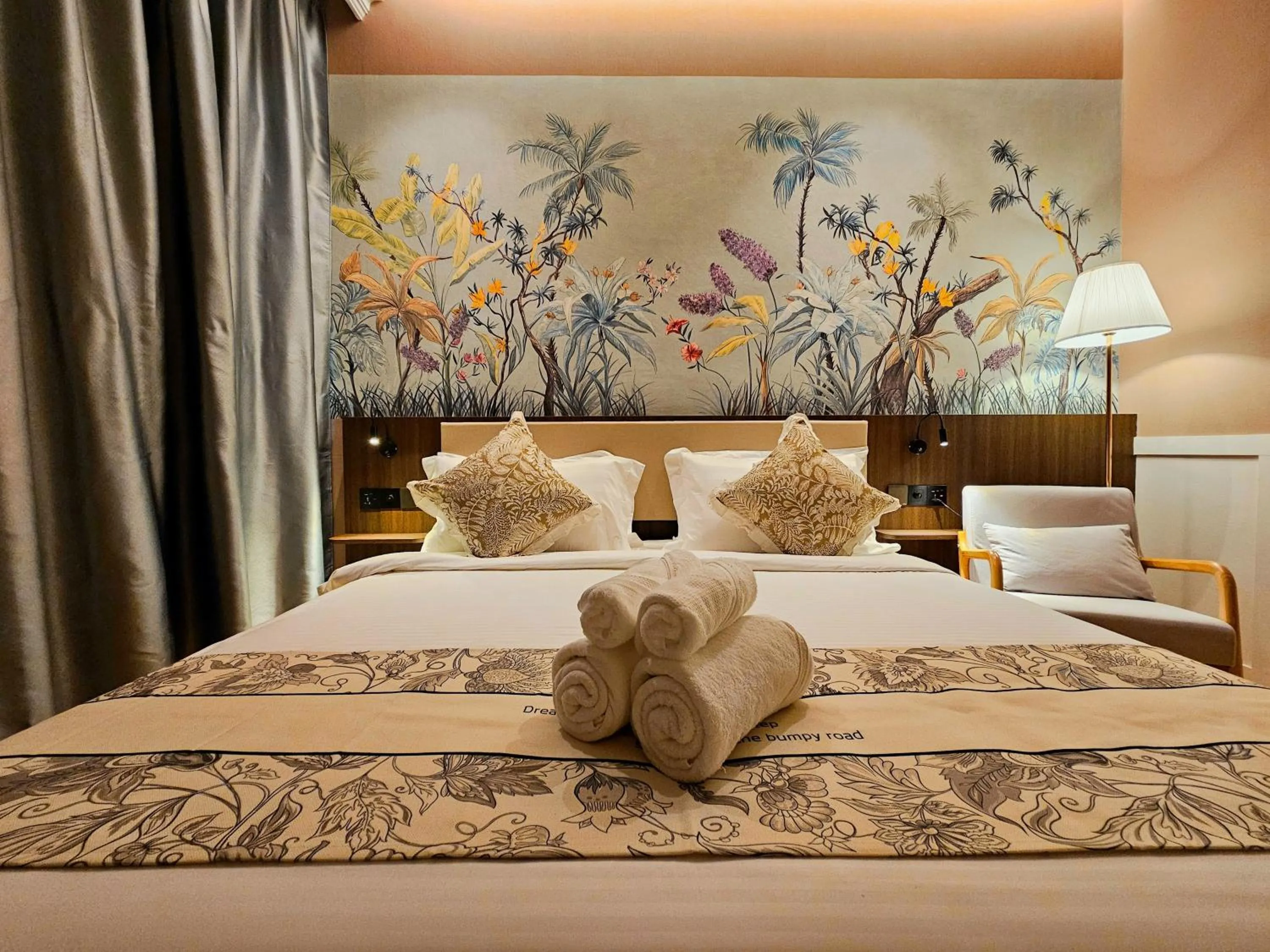 Bed in The Palm Suite at Lava Mansion