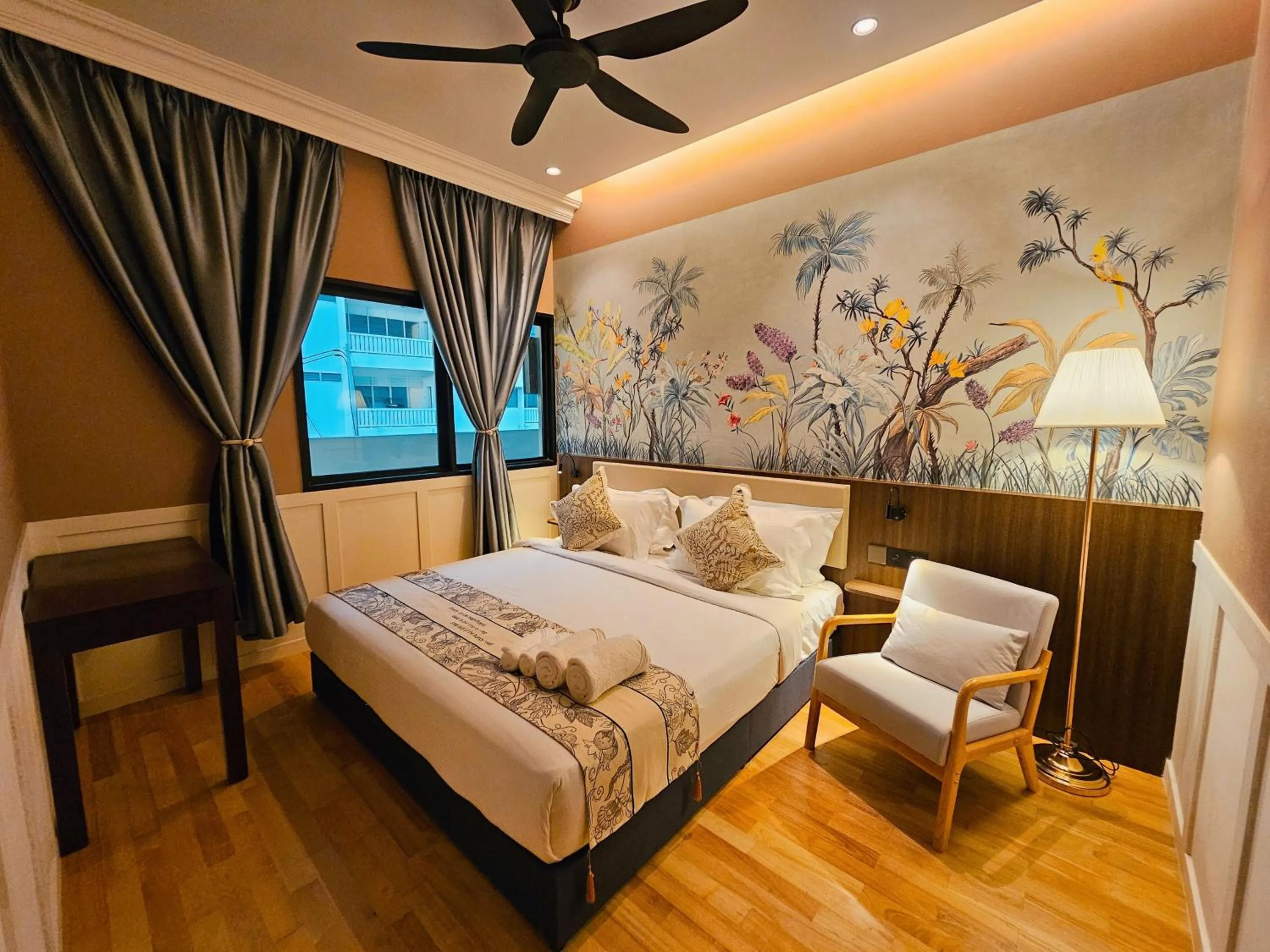 Bed in The Palm Suite at Lava Mansion