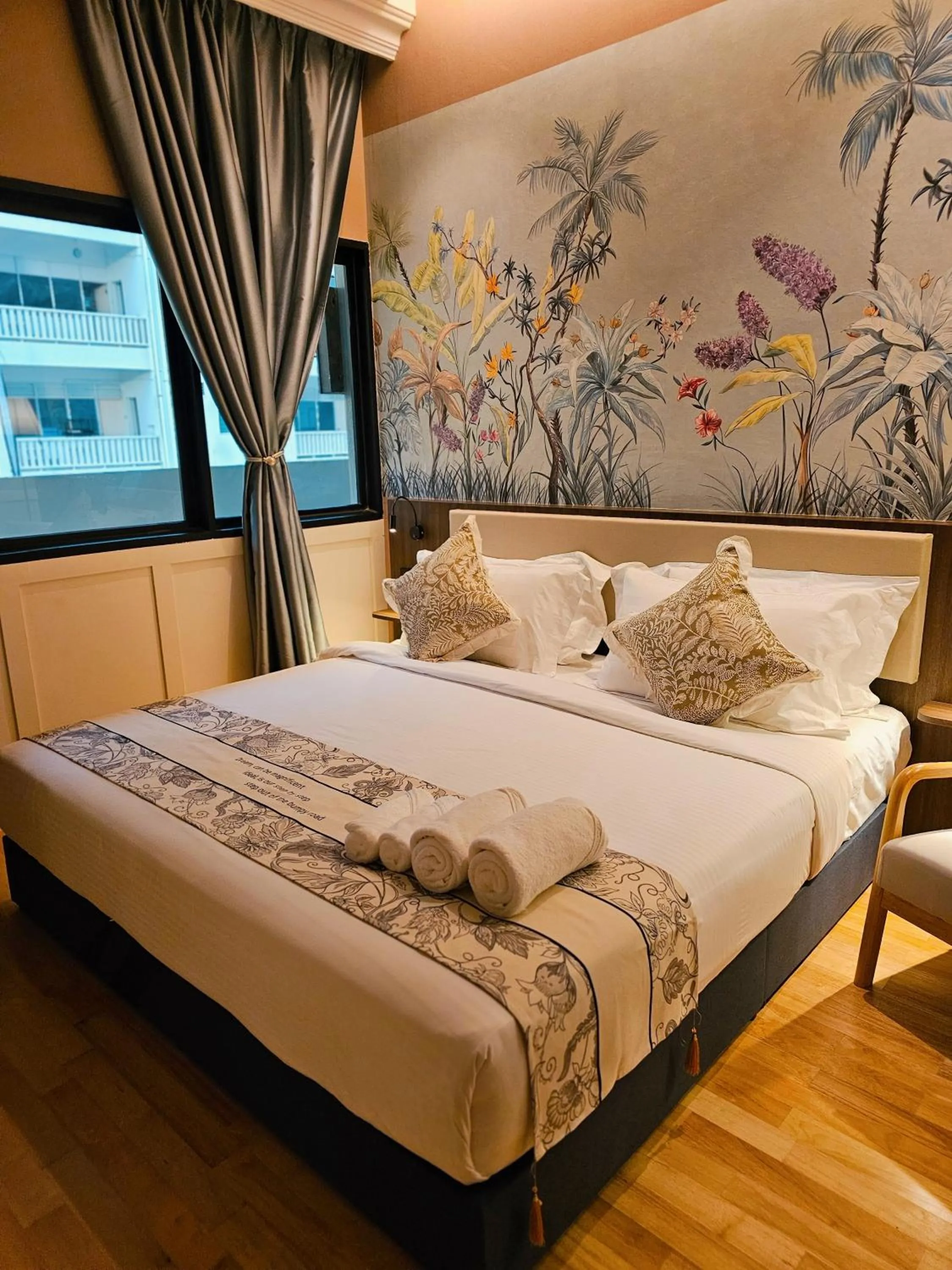 Bed in The Palm Suite at Lava Mansion