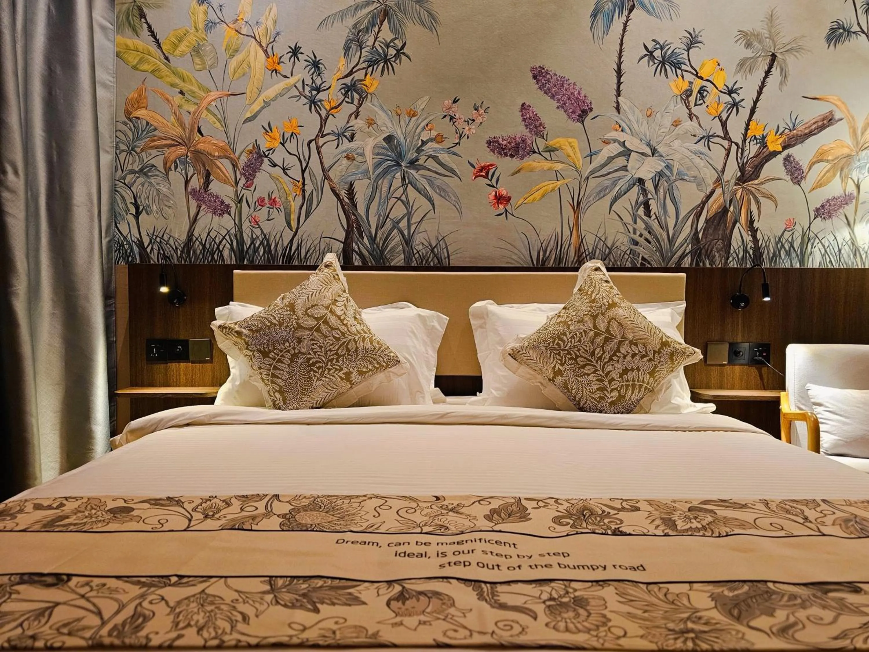 Bed in The Palm Suite at Lava Mansion