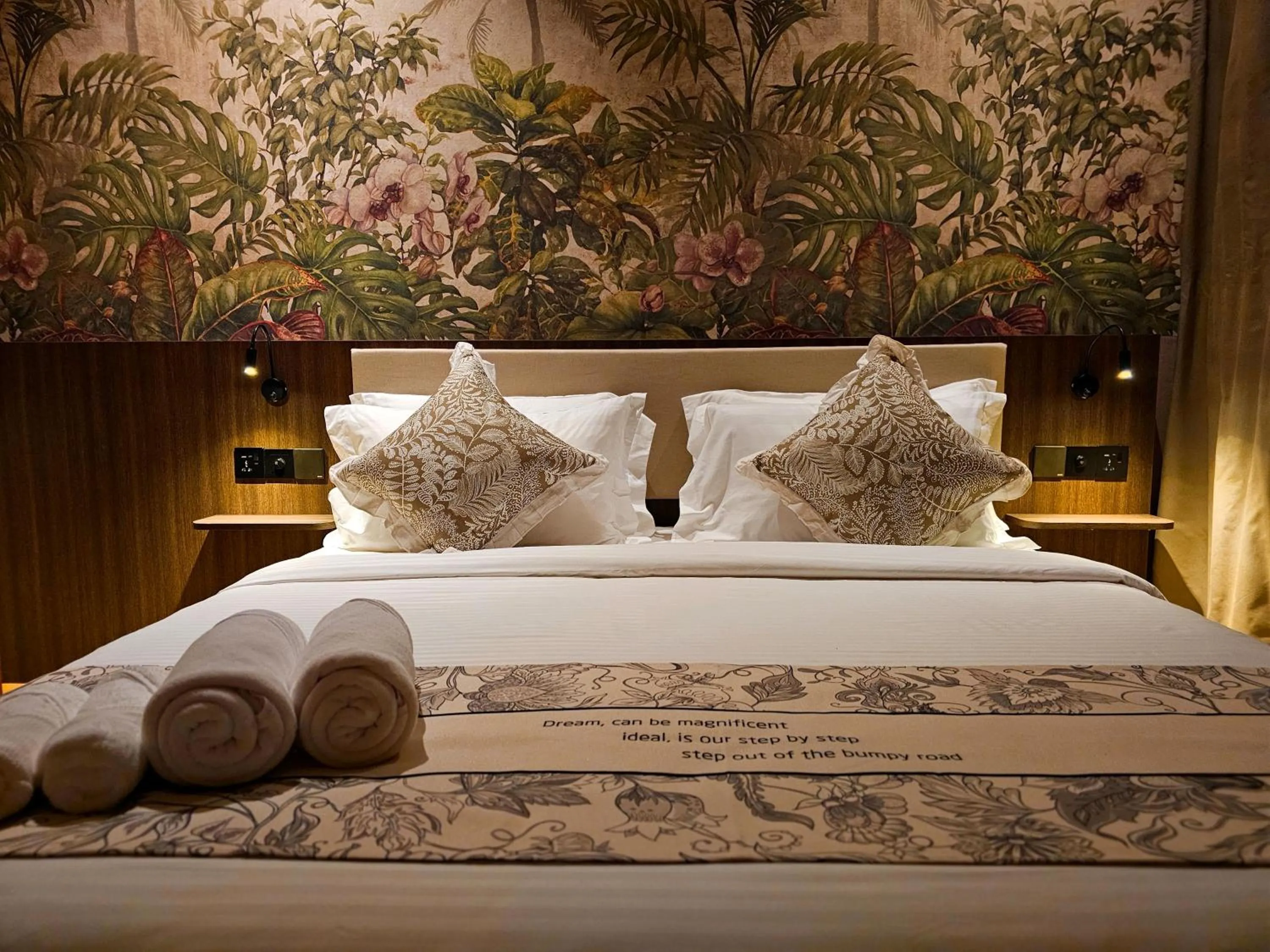 Bed in The Palm Suite at Lava Mansion