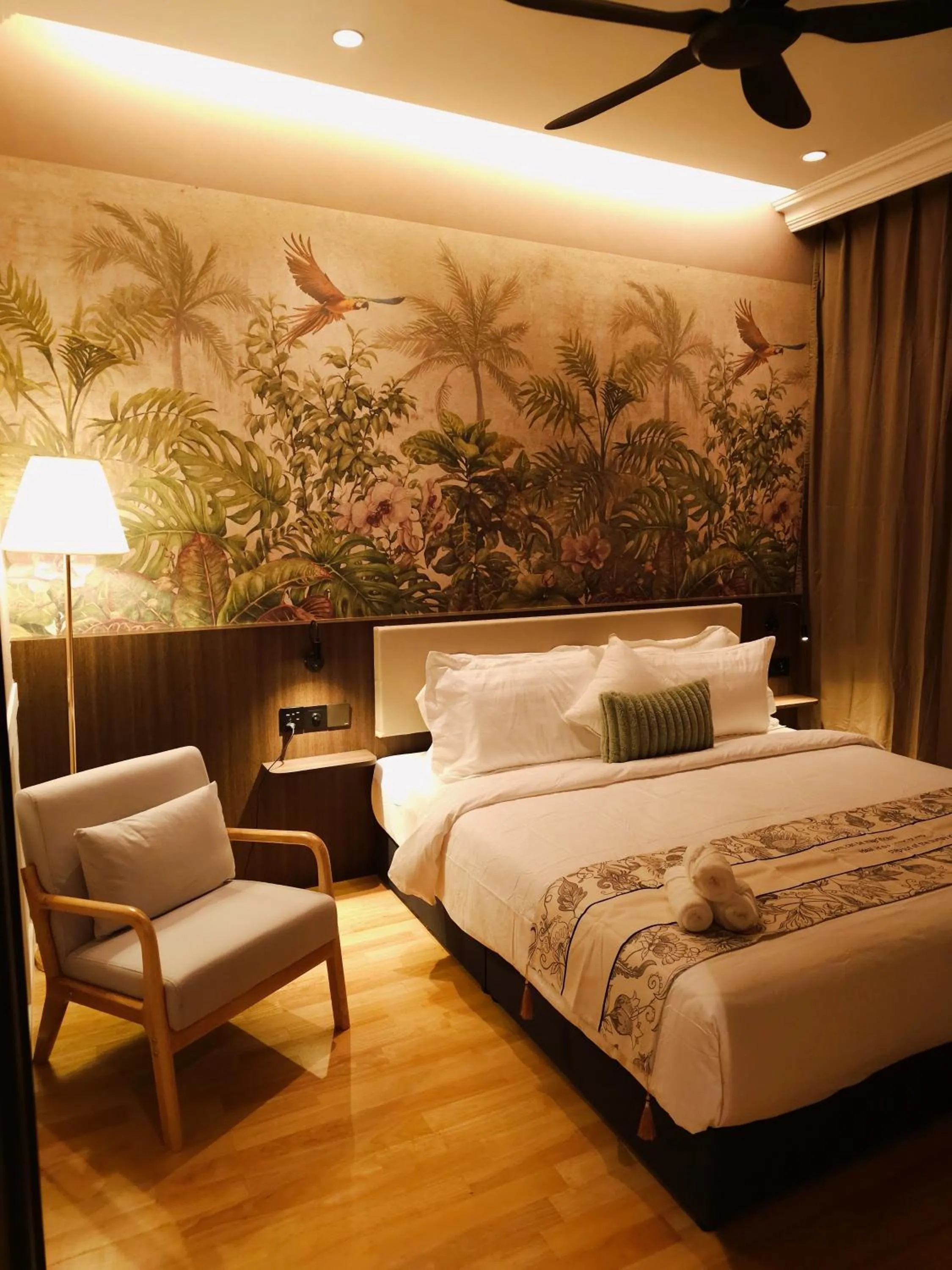 Bed in The Palm Suite at Lava Mansion