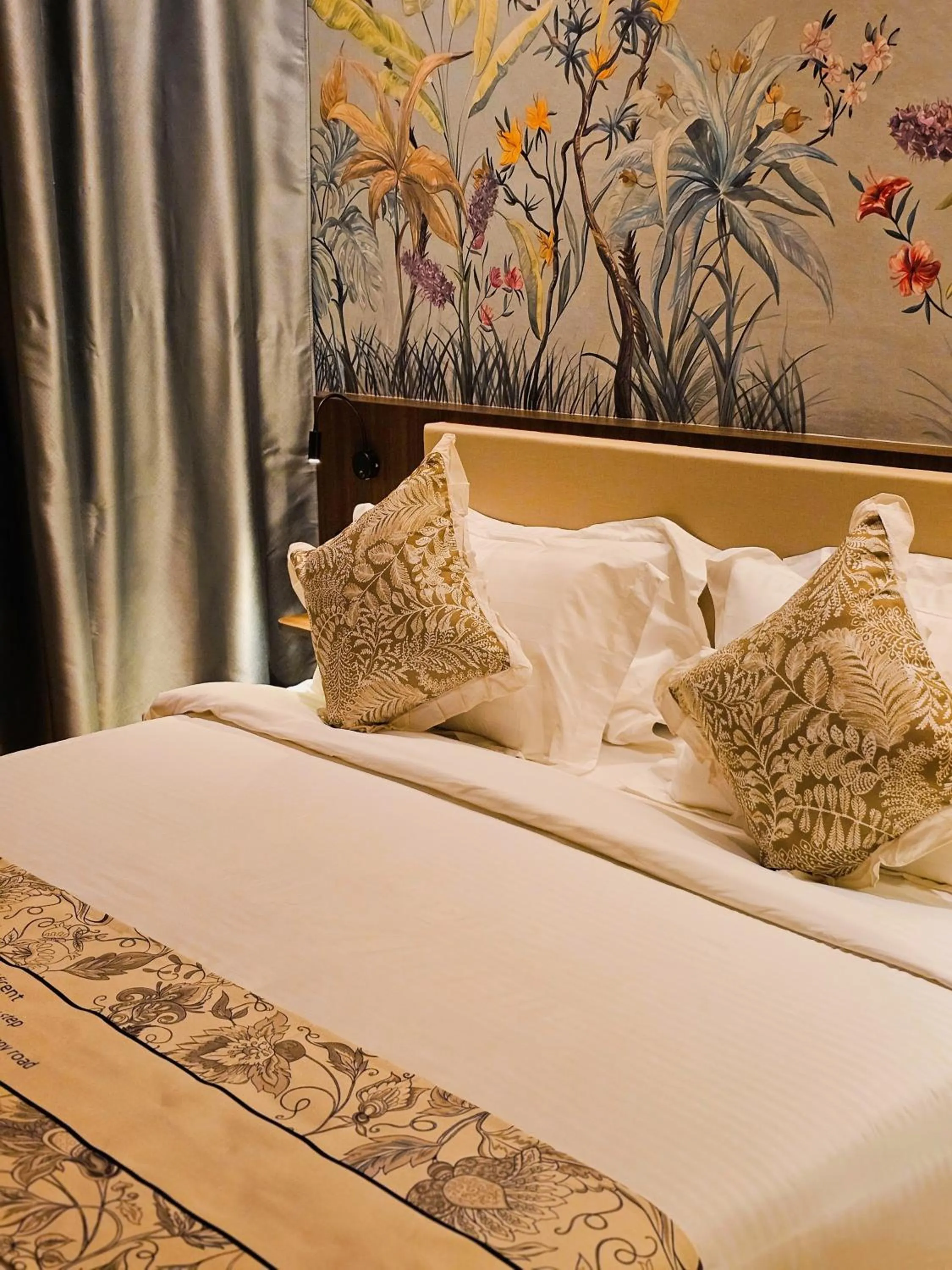 Bed in The Palm Suite at Lava Mansion