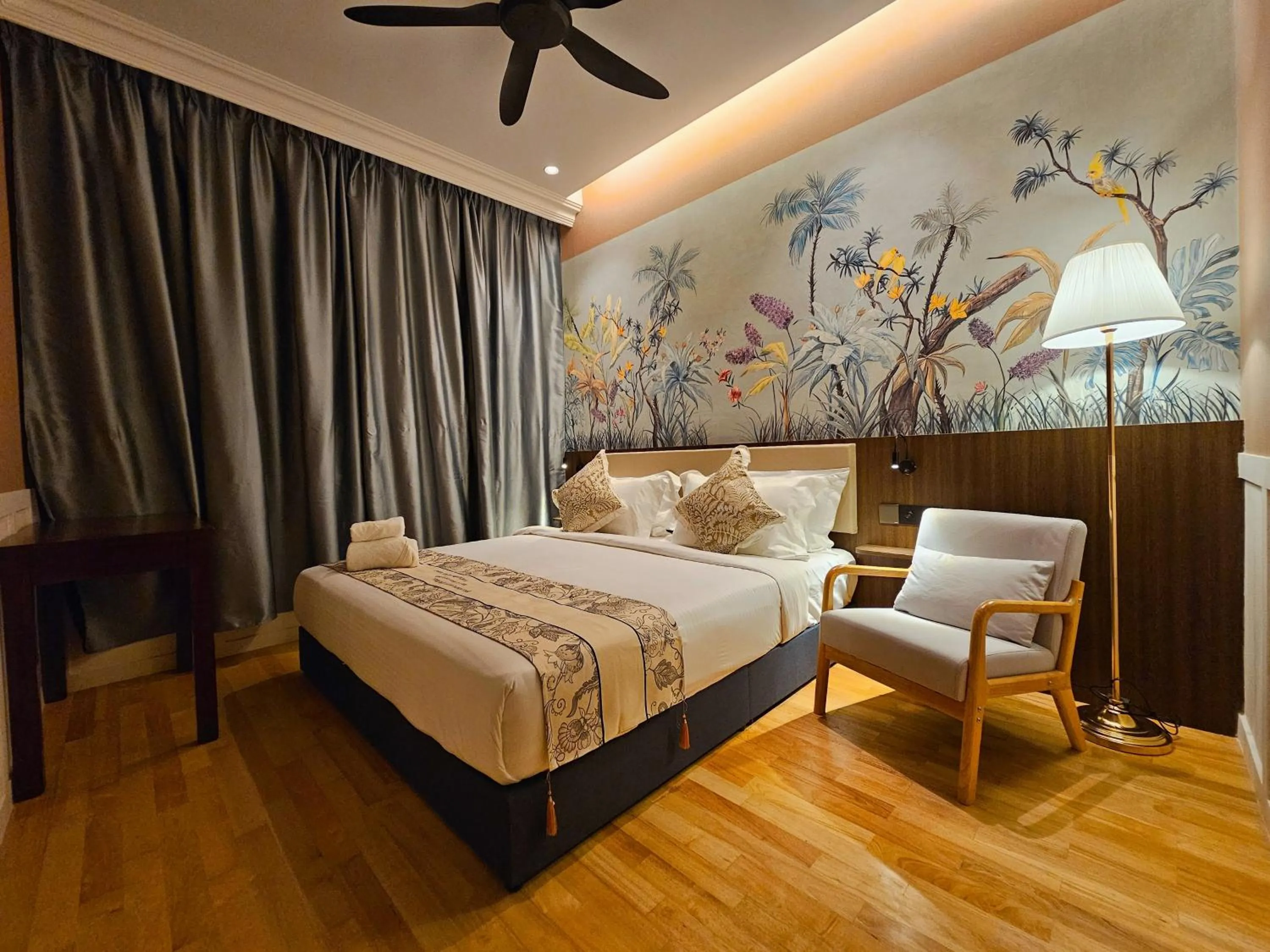 Bed in The Palm Suite at Lava Mansion