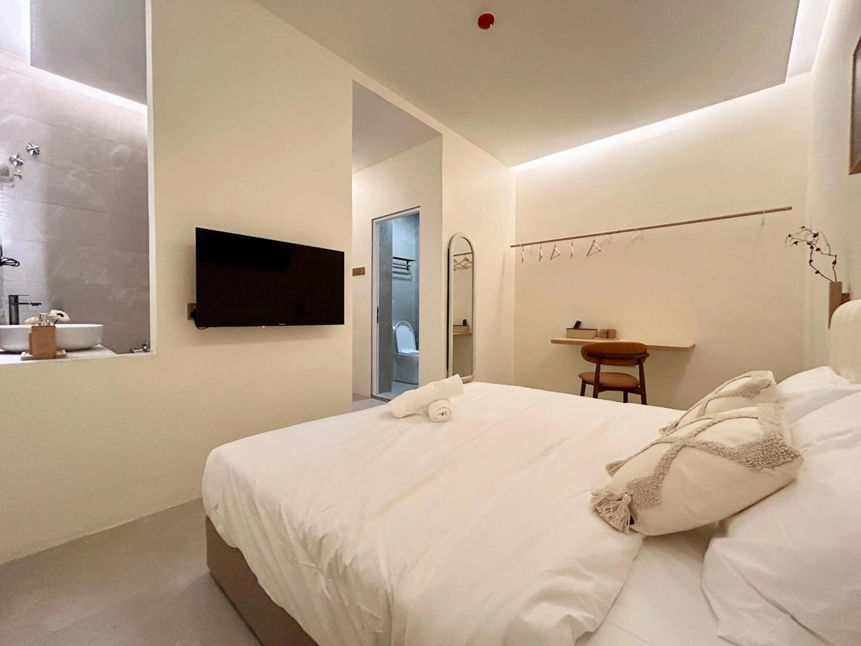 Bed in ONE18 Boutique Hotel