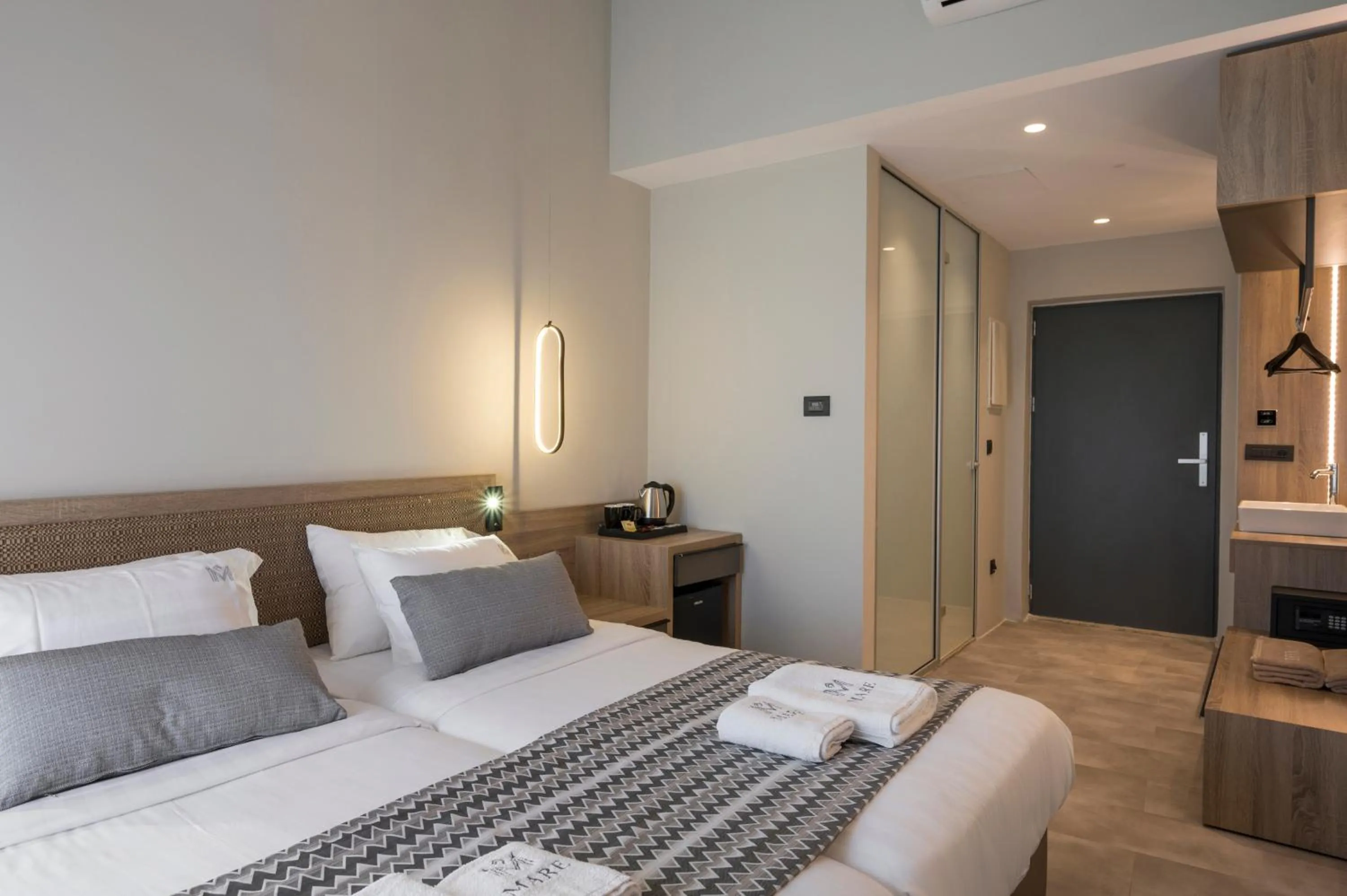 Bed in Mare Village Hotel