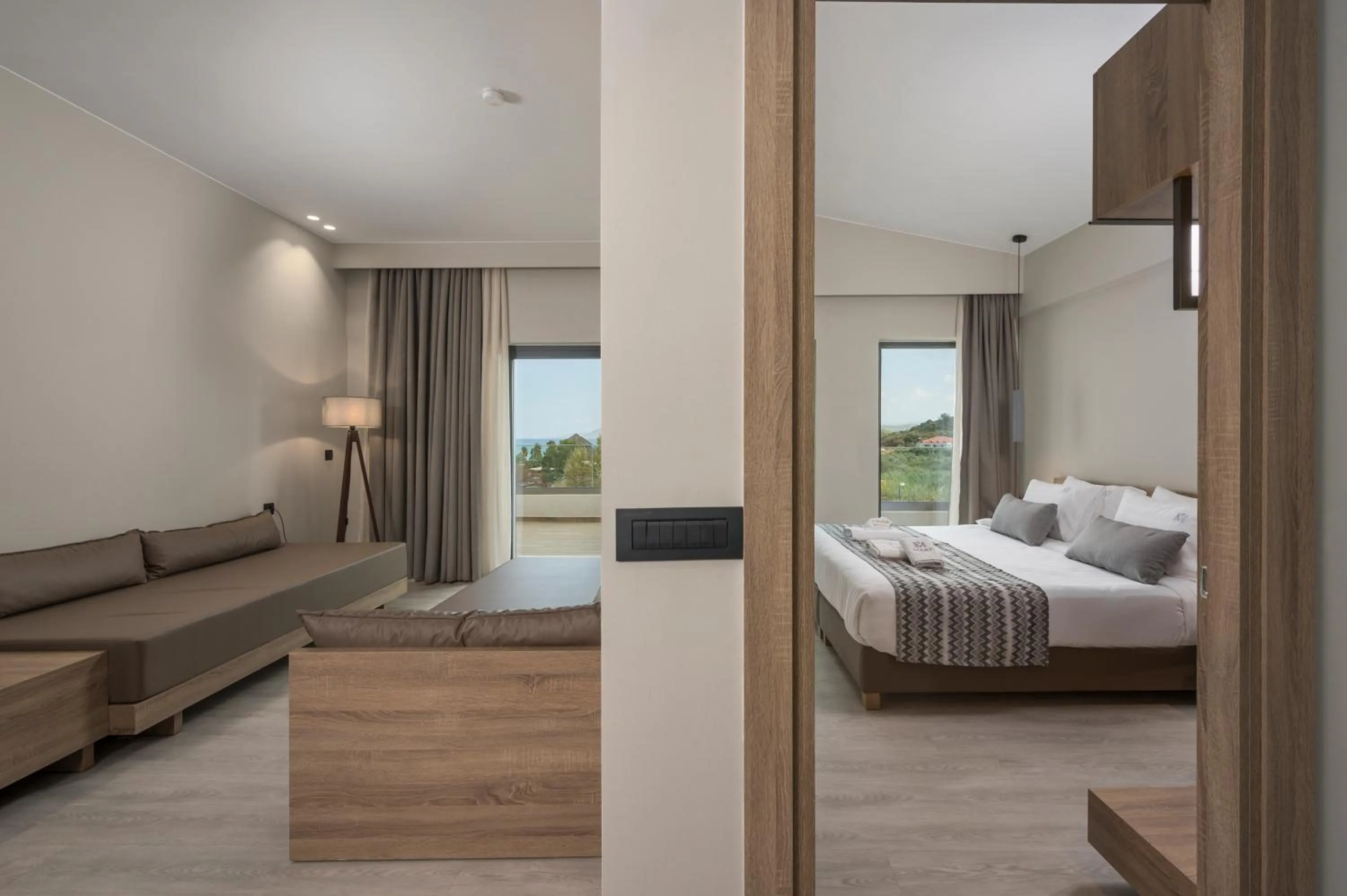 Seating area, Bed in Mare Village Hotel