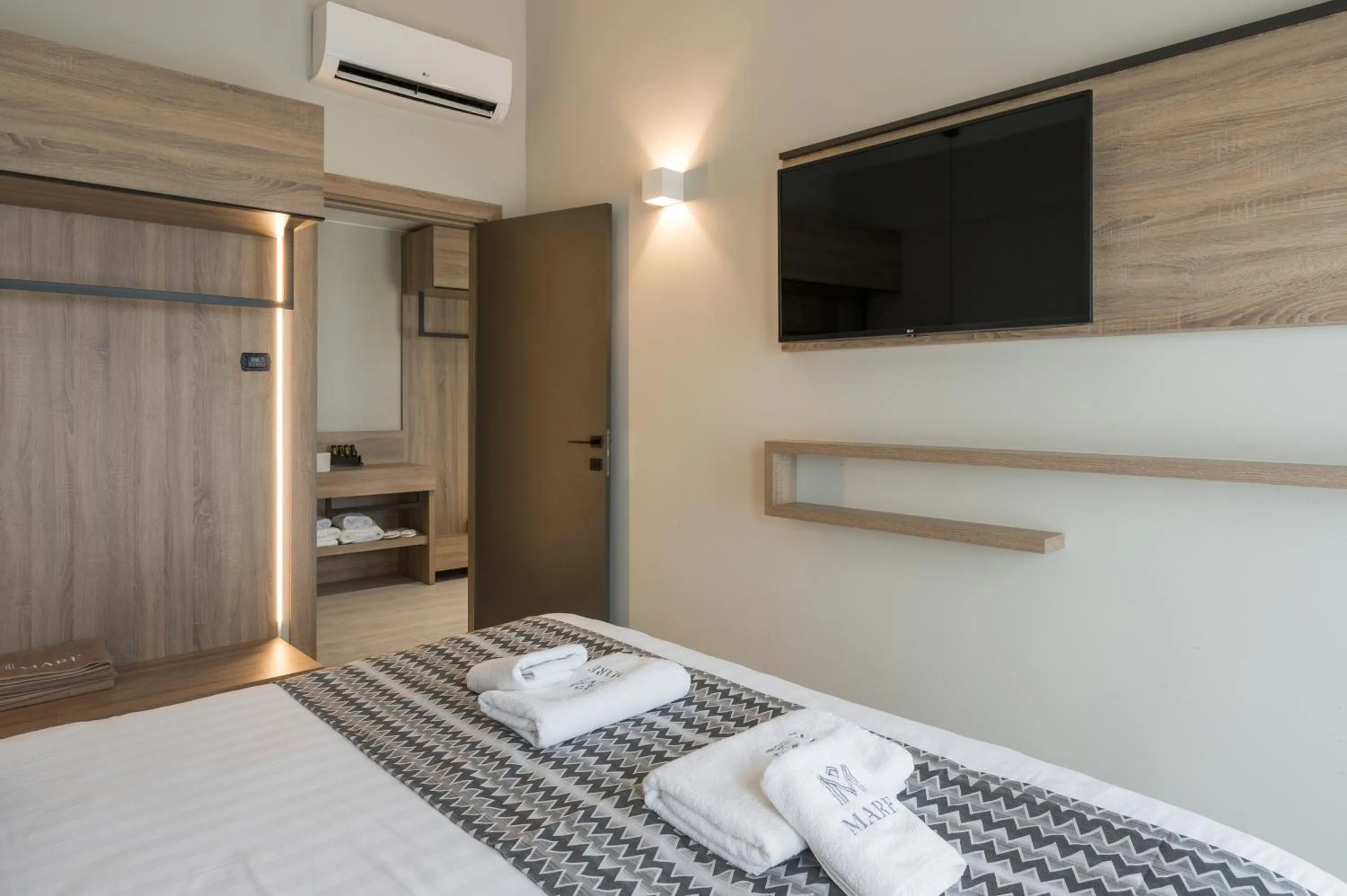 Bed in Mare Village Hotel