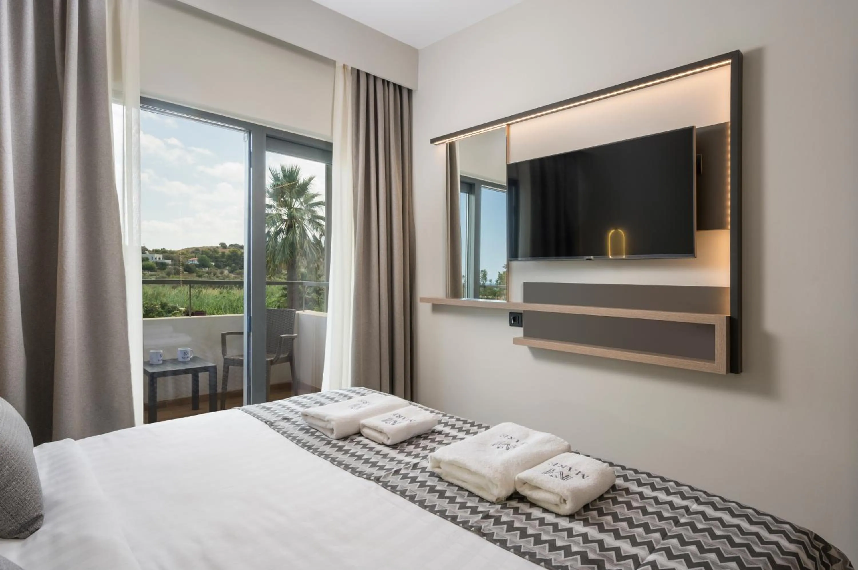 Bed in Mare Village Hotel