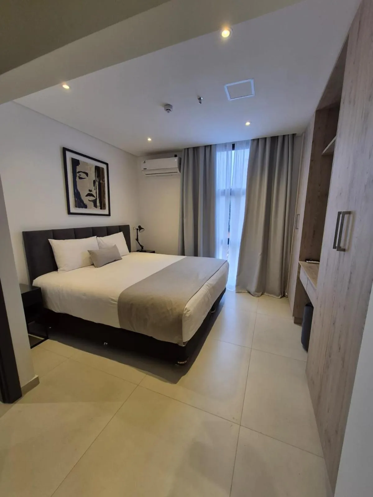 Bed in Divina Tower Apart Hotel