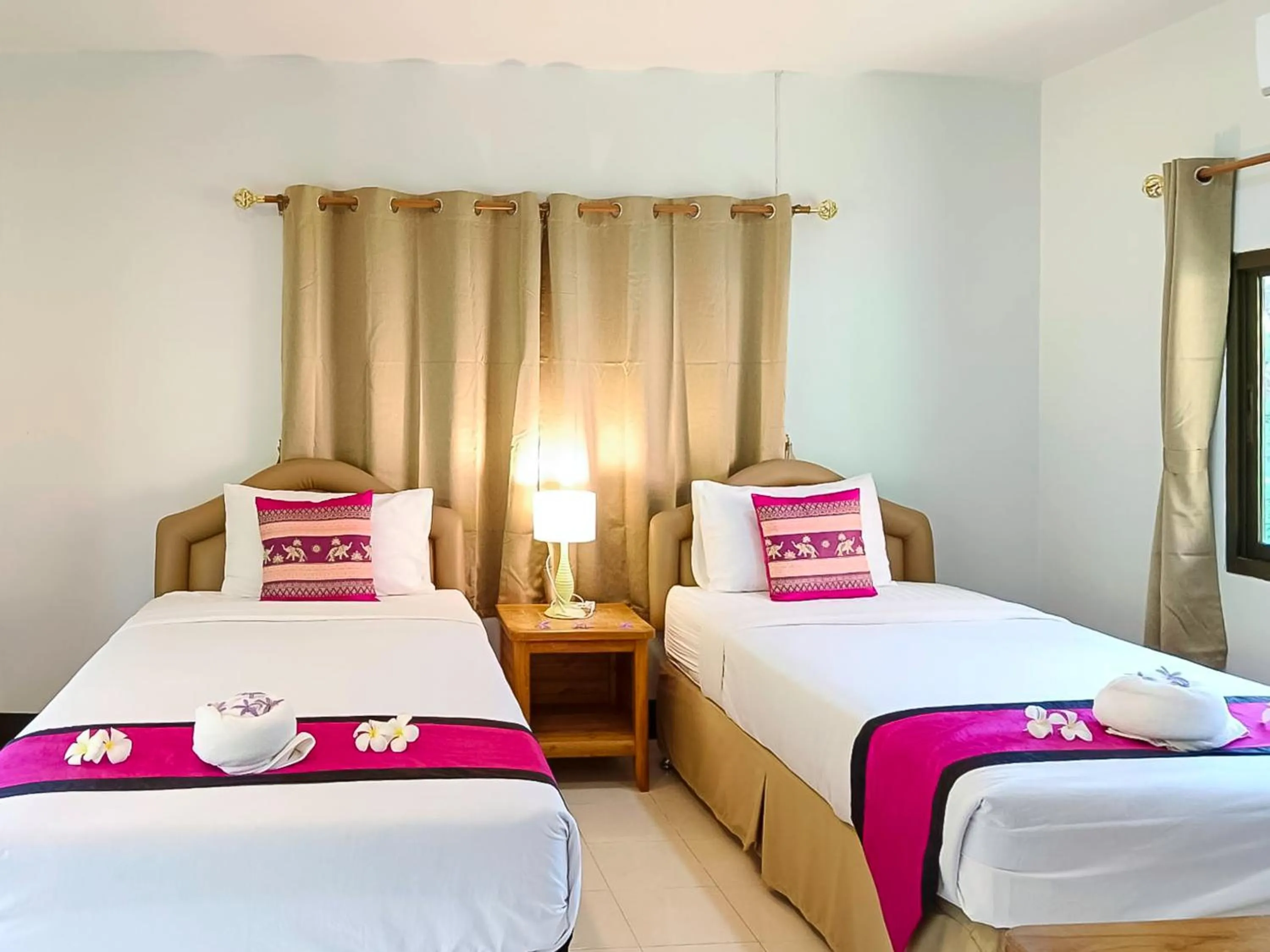 Bed in Saitharn Iyara Resort