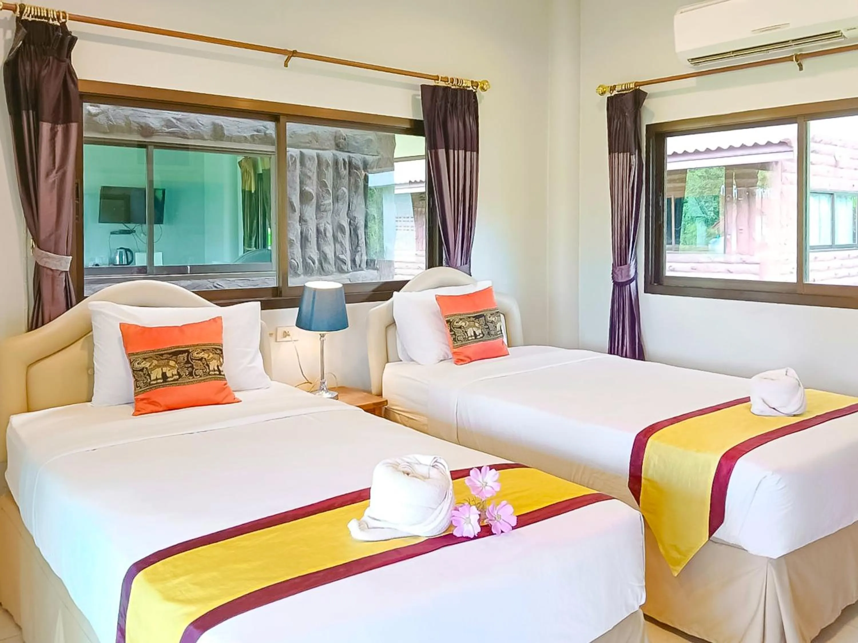 Bed in Saitharn Iyara Resort