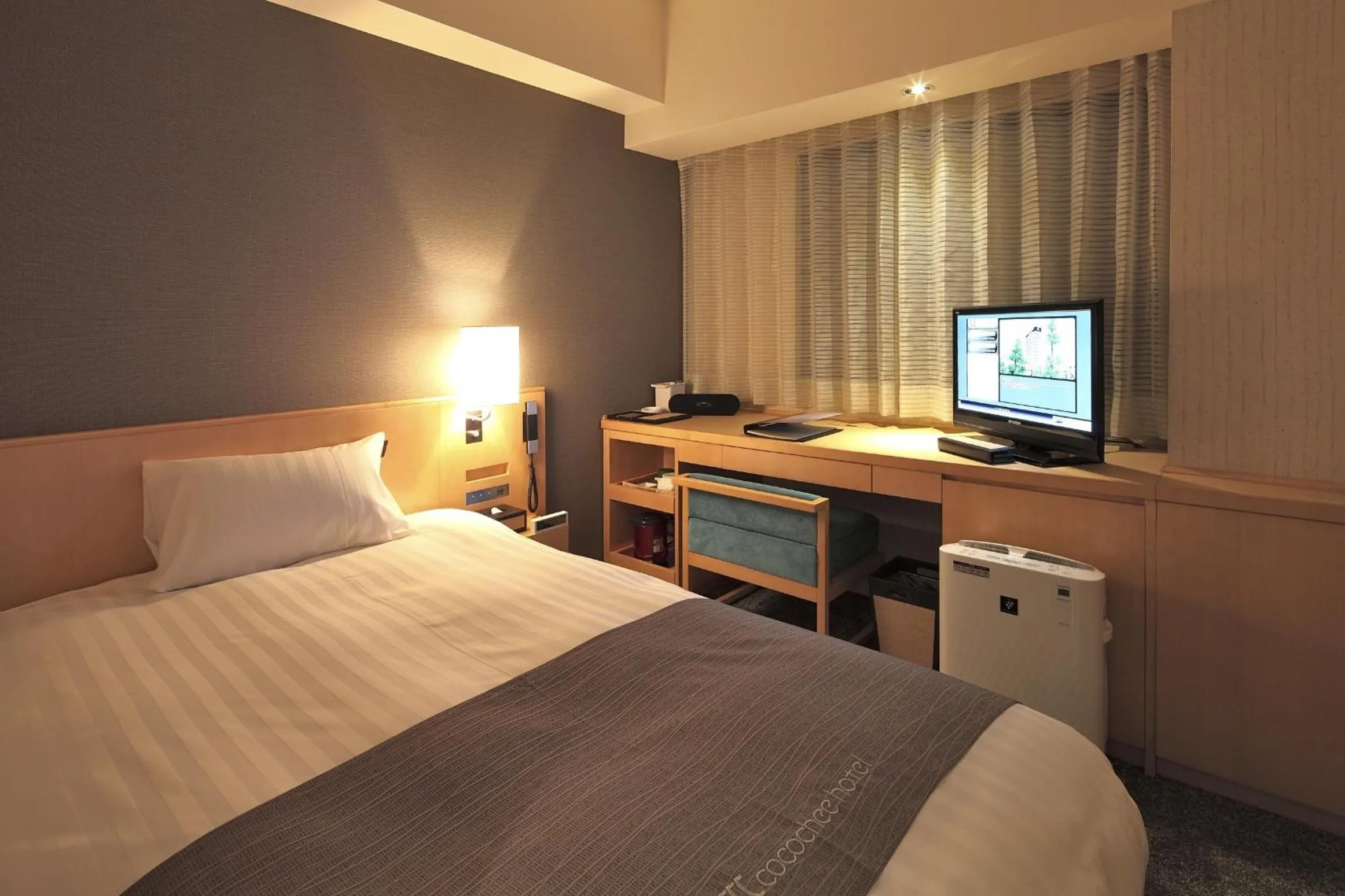 Bed in Cocochee Hotel Numazu