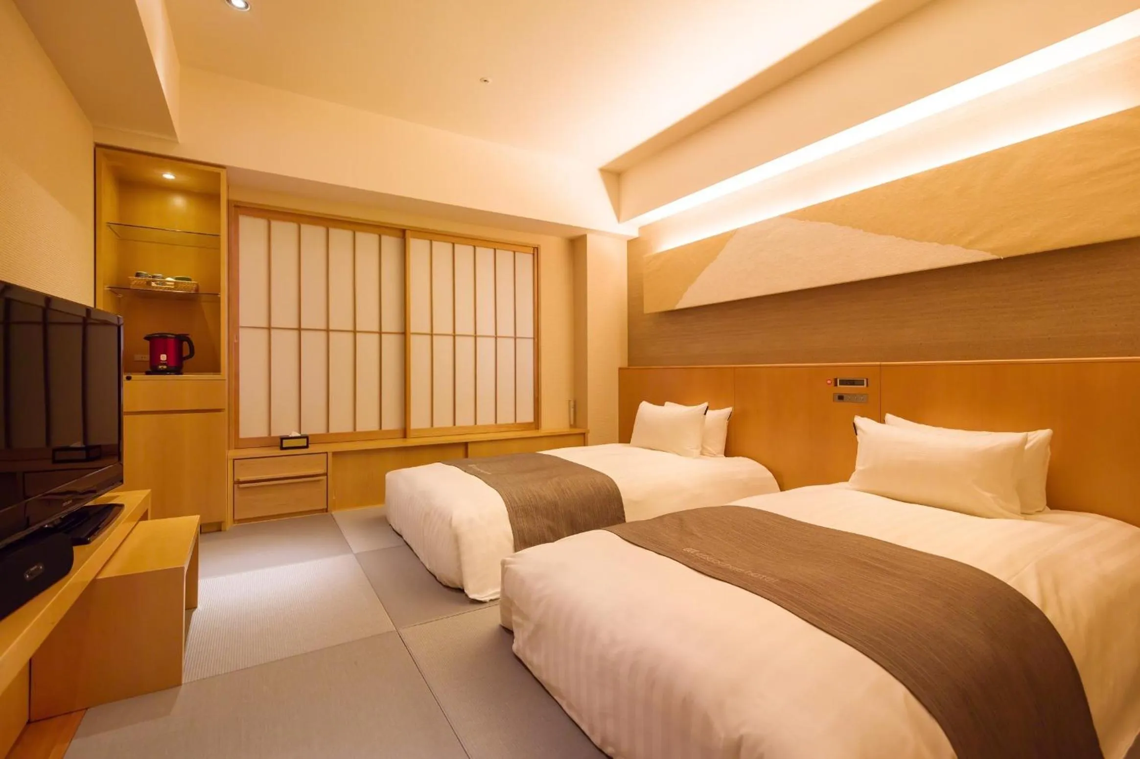 Photo of the whole room, Bed in Cocochee Hotel Numazu