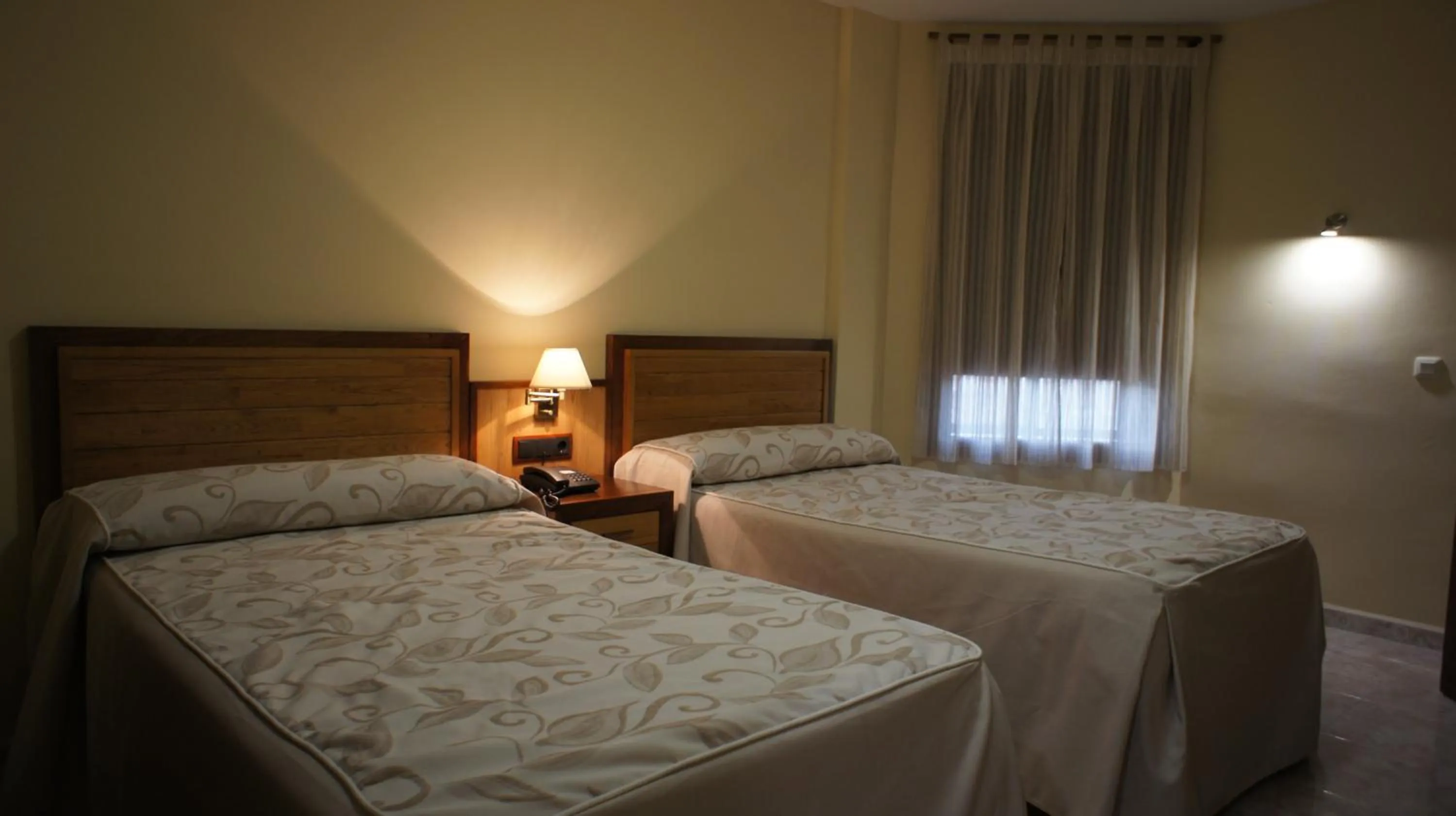 Bed in Hotel Puente Romano