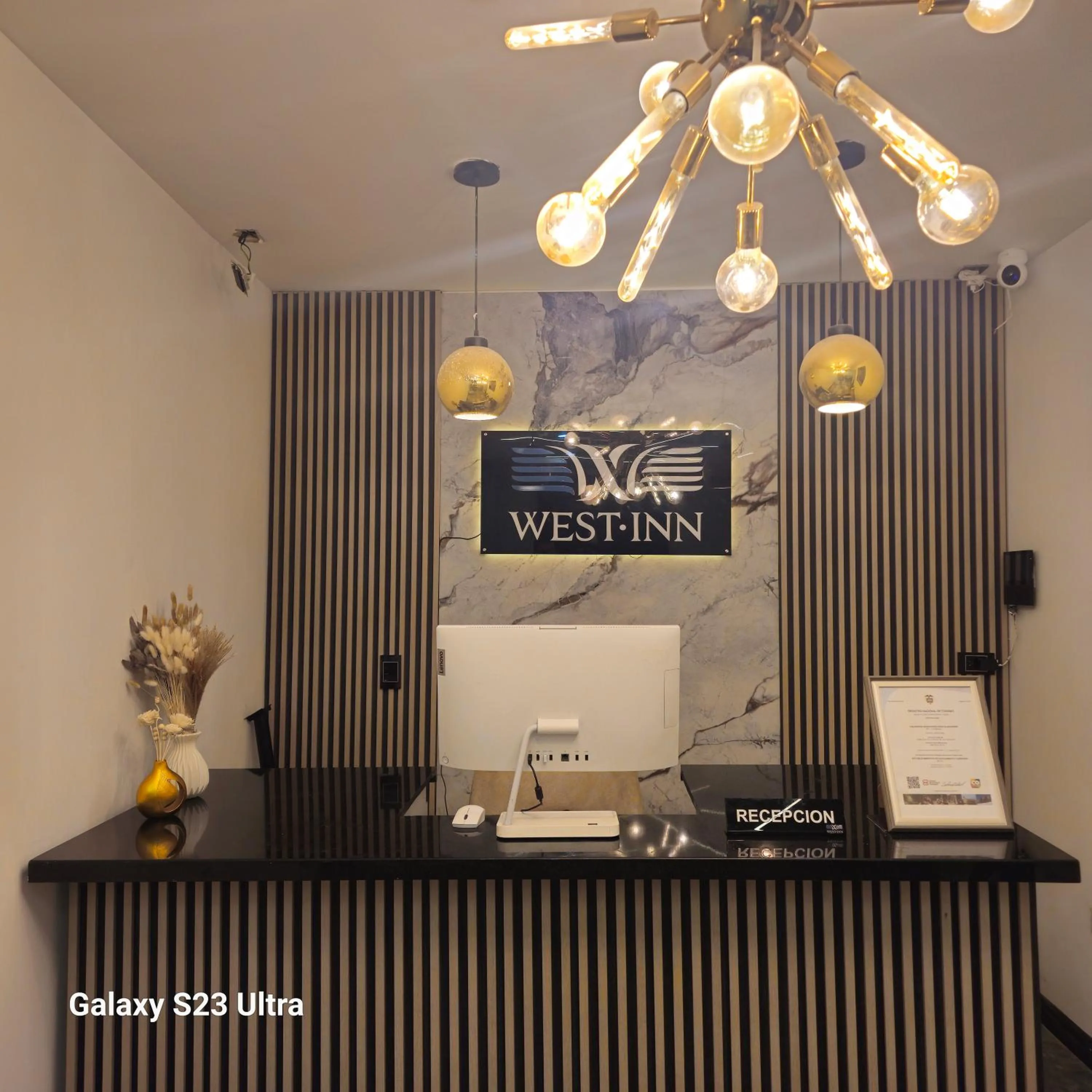 Property logo or sign in Hotel West Inn