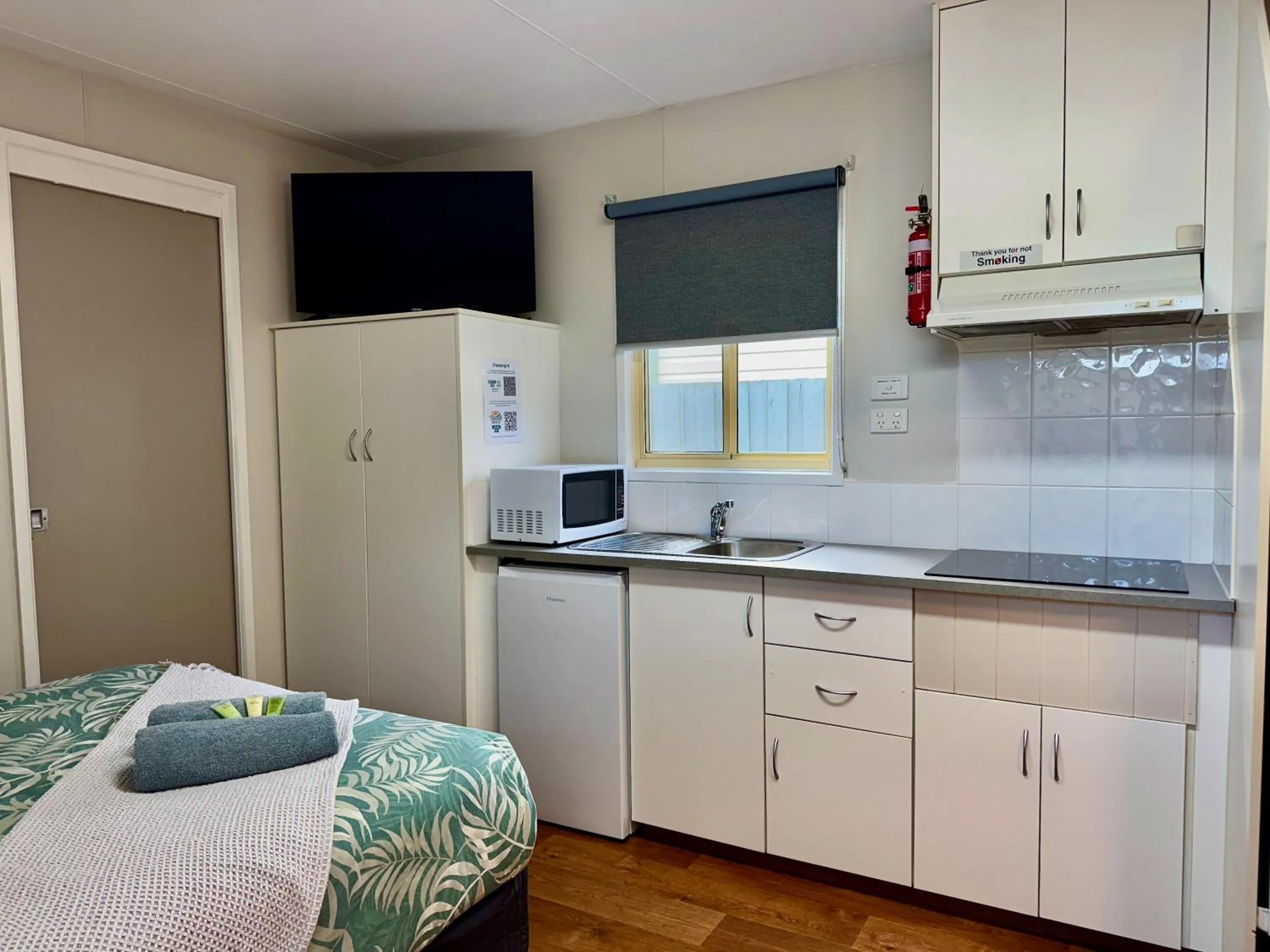 Kitchen or kitchenette, Bed in Kanasta Caravan Park