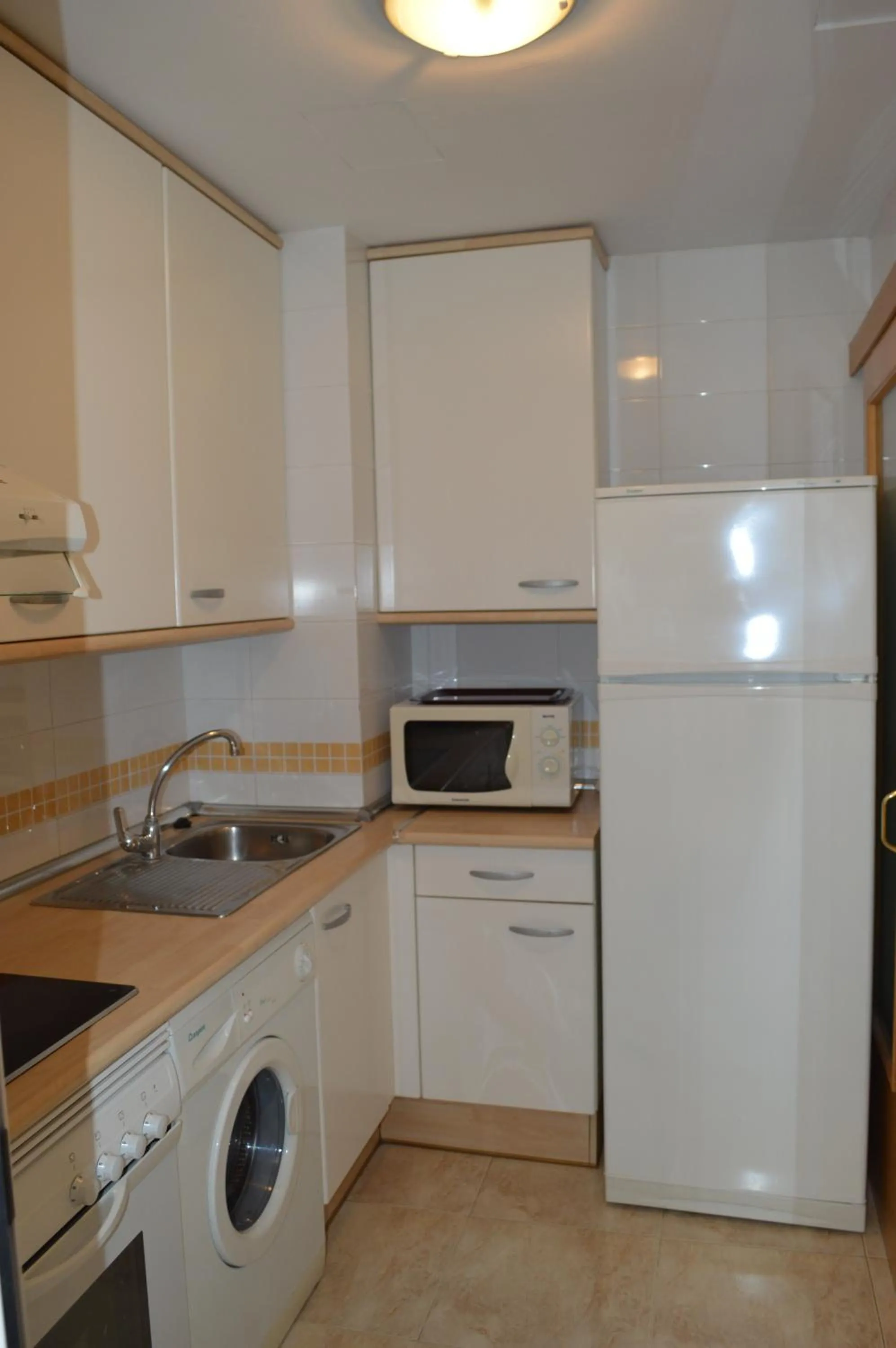 Kitchen or kitchenette in JOYAPARTMENTS Golden Pineda