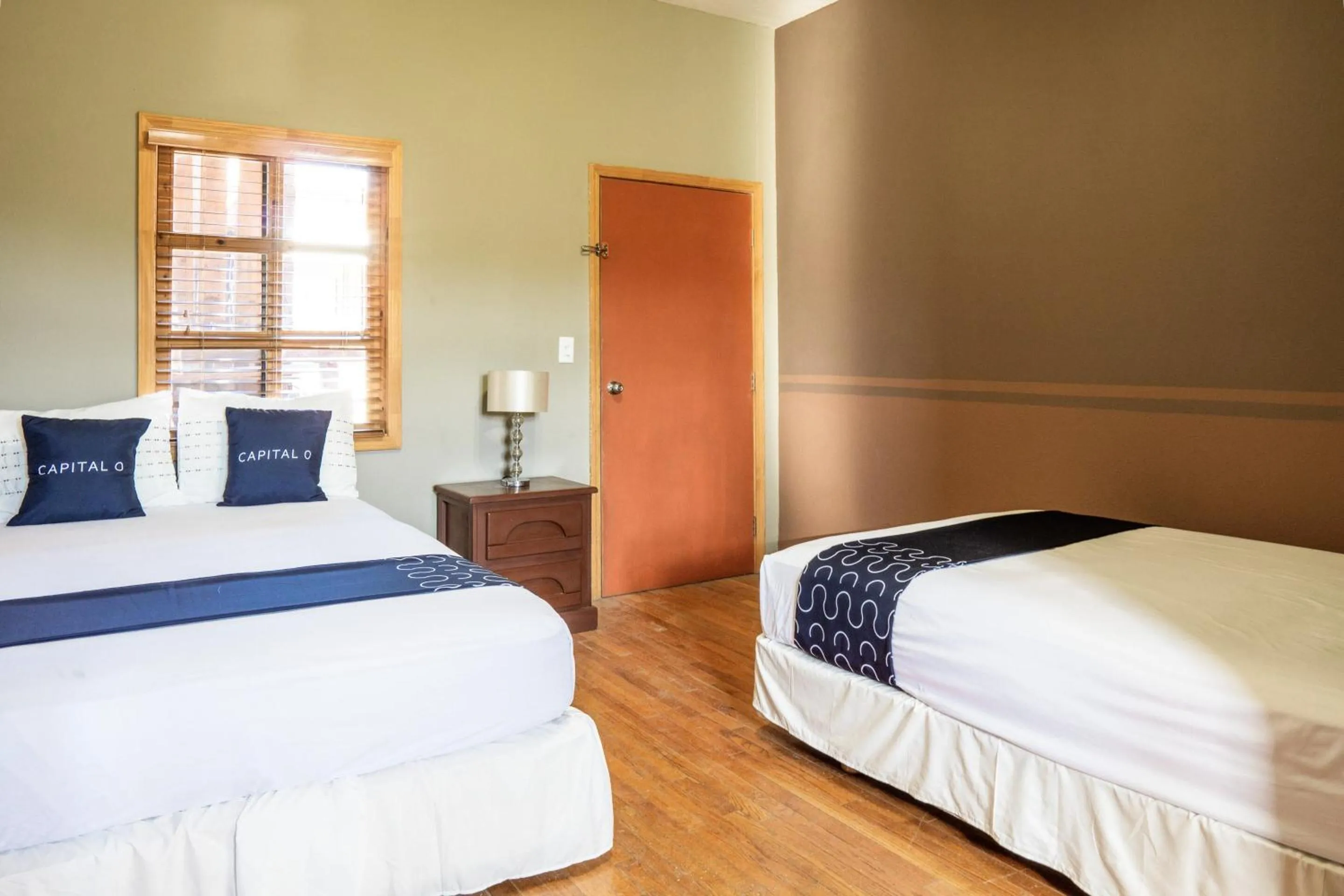 Bedroom, Bed in Capital O Hotel Villa Azura