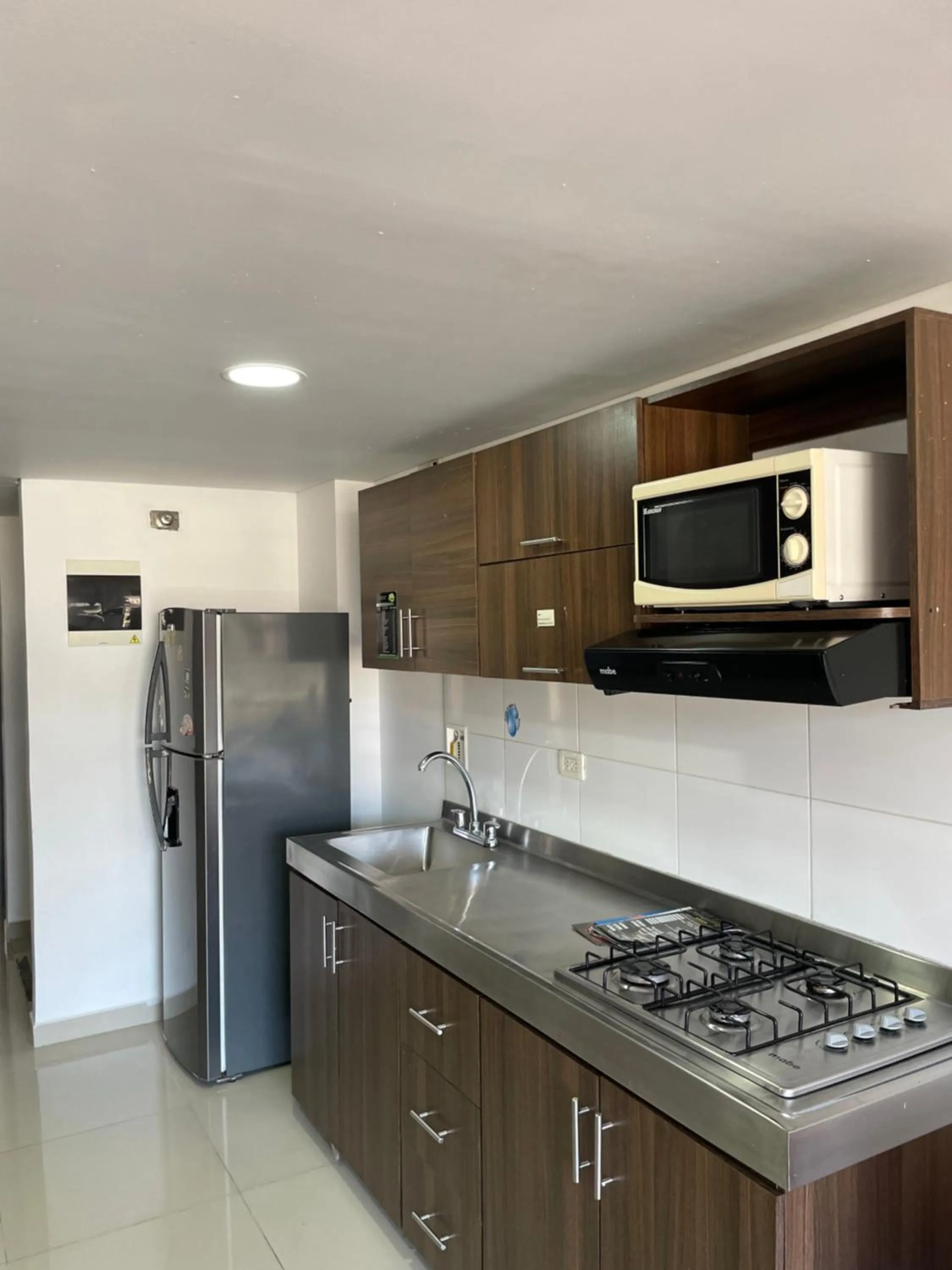 Kitchen or kitchenette in Ivanna Jumar ApartaHotel - Laureles Estadio