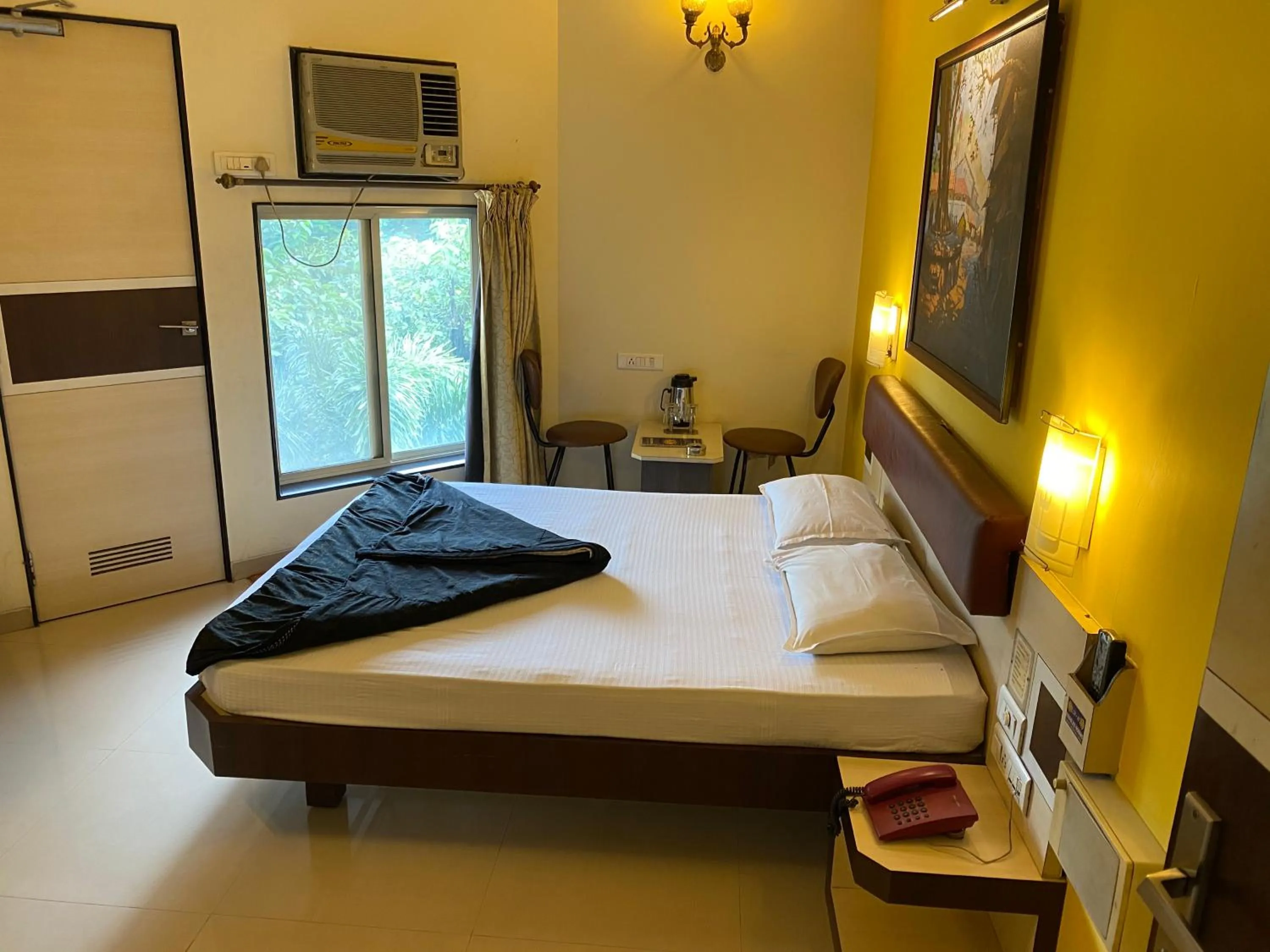 Bed in Panchavati Elite Inn