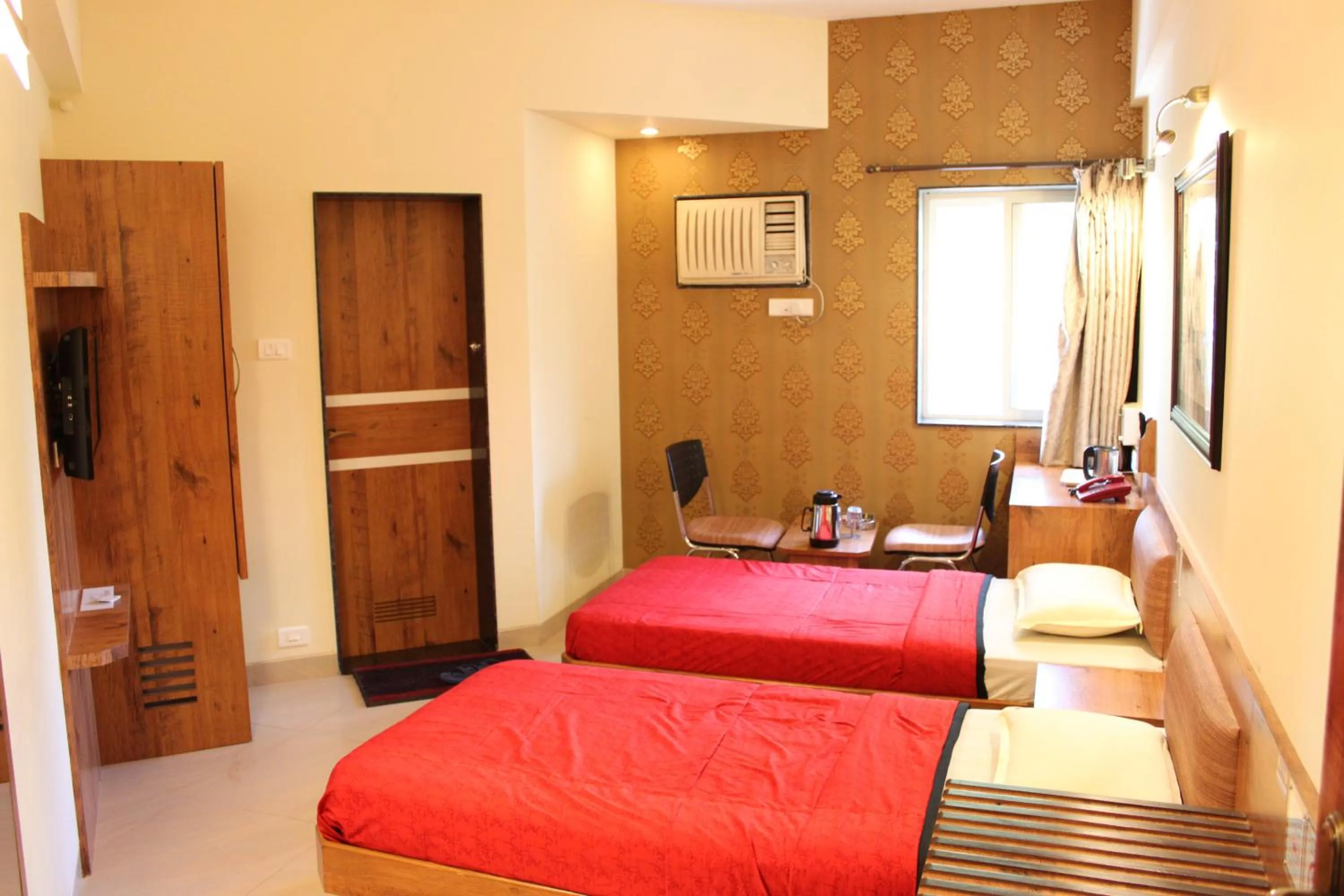 Bed in Panchavati Elite Inn