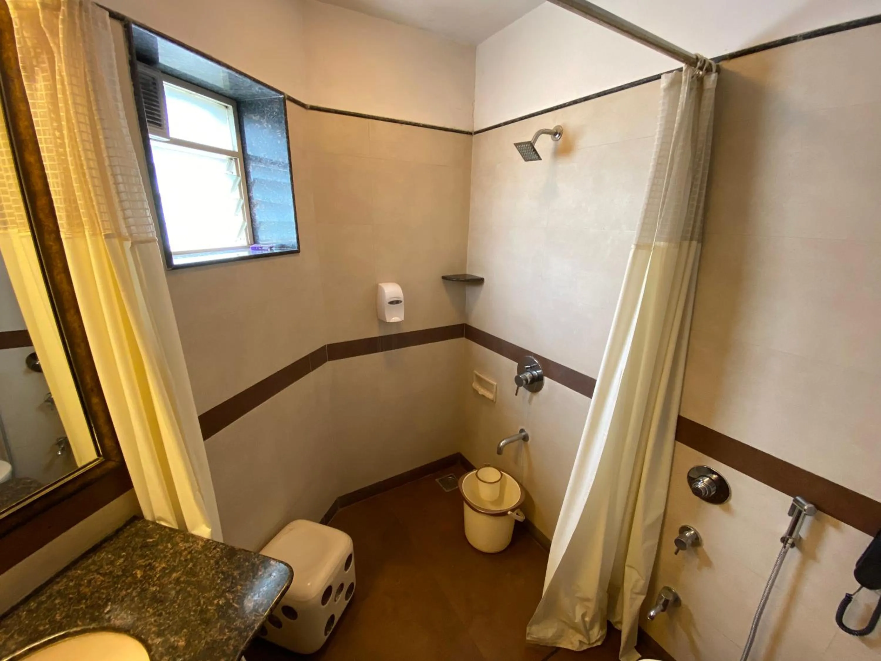 Bathroom in Panchavati Elite Inn