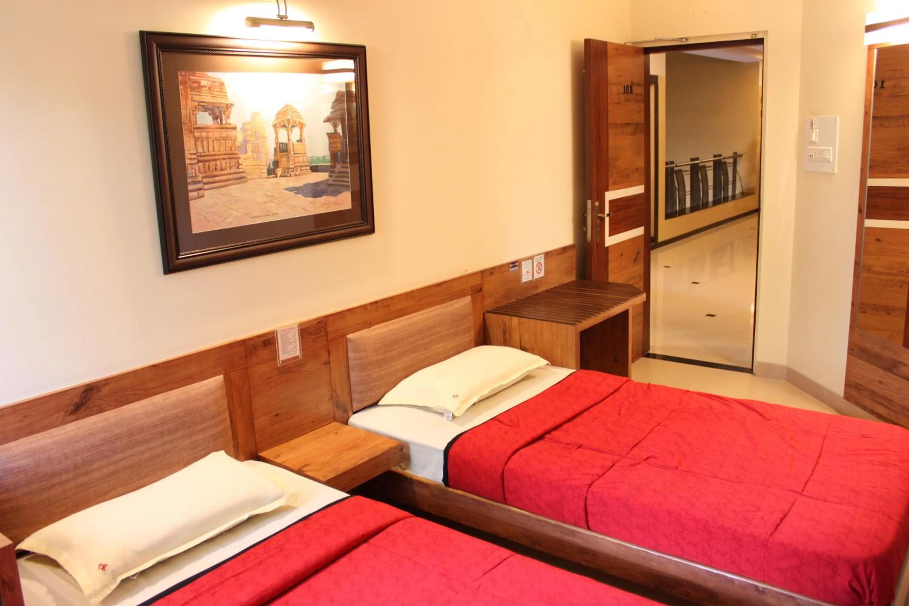 Bed in Panchavati Elite Inn