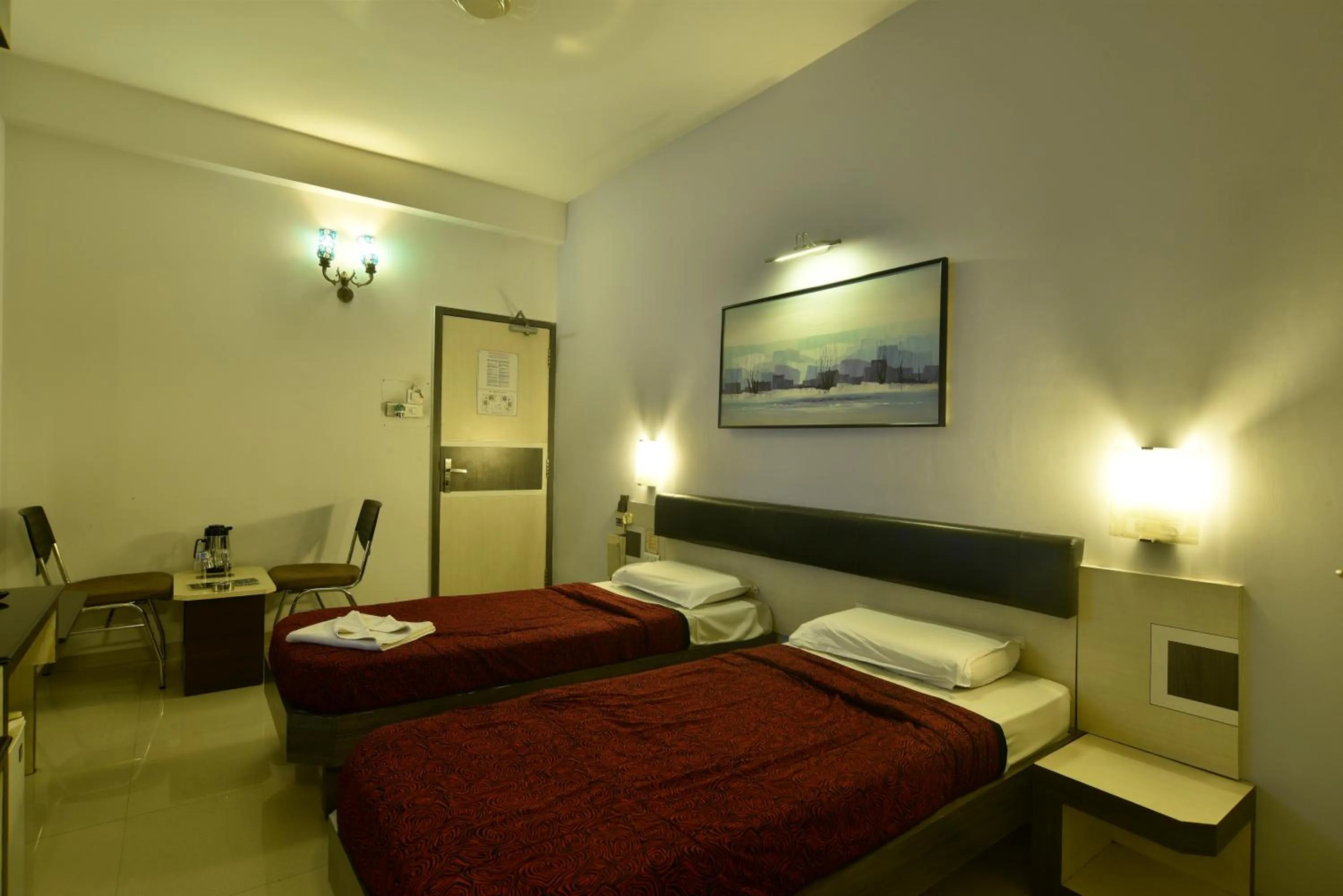 Bed in Panchavati Elite Inn