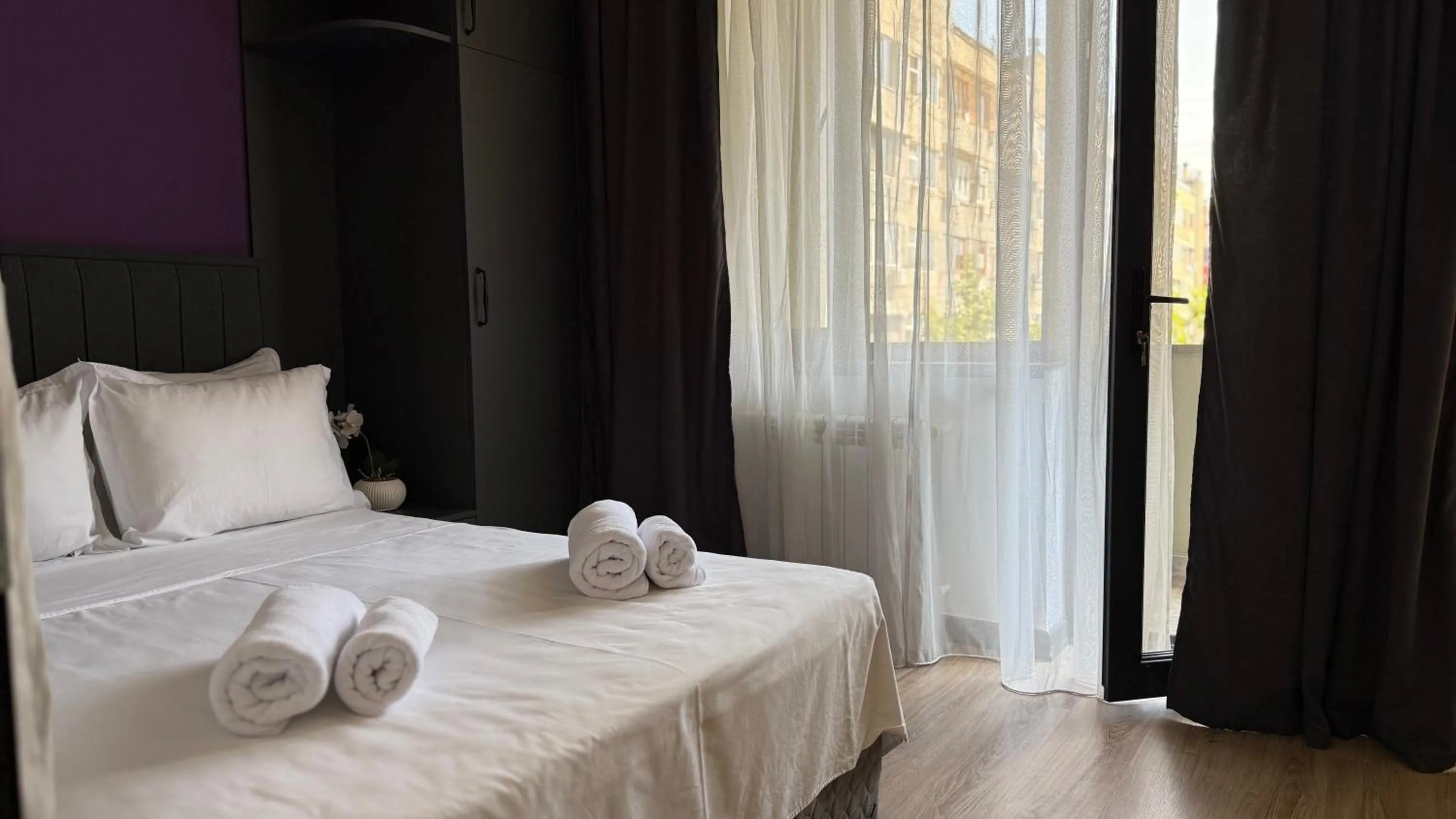 Bed in Sweet Home Deluxe Apart-Hotel