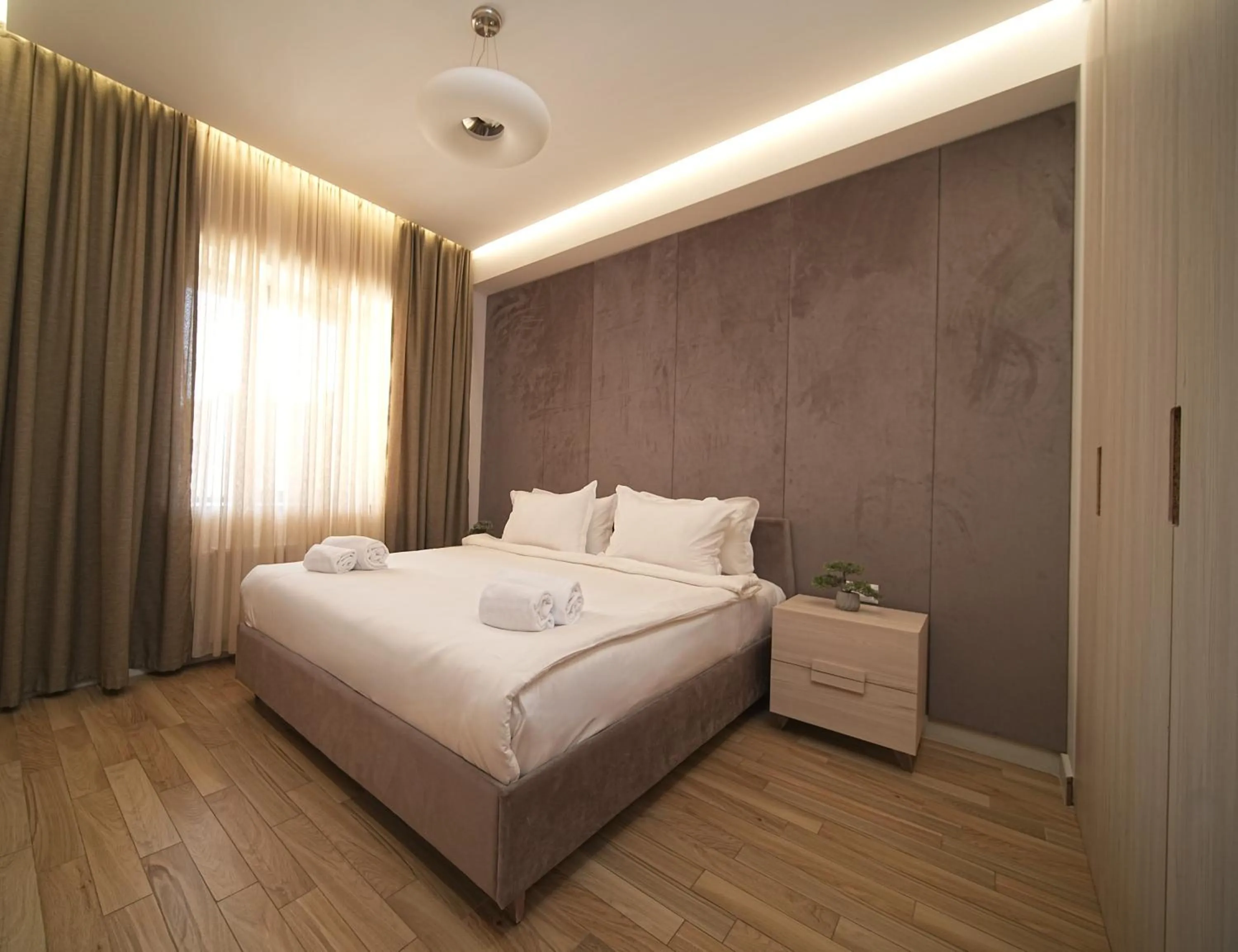 Bed in Sweet Home Deluxe Apart-Hotel