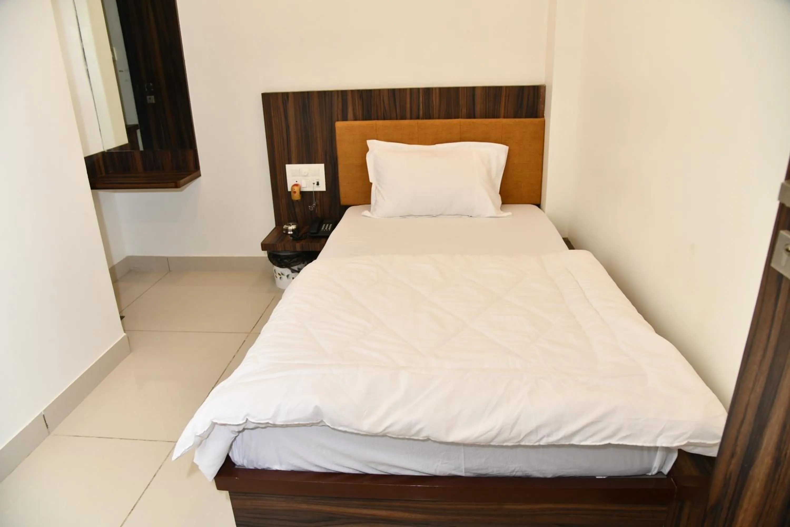 Bed in Hotel Shreeji Palace