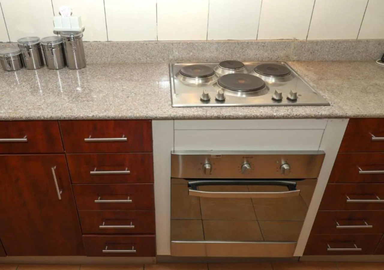 stove in Golf View Serviced Apartments