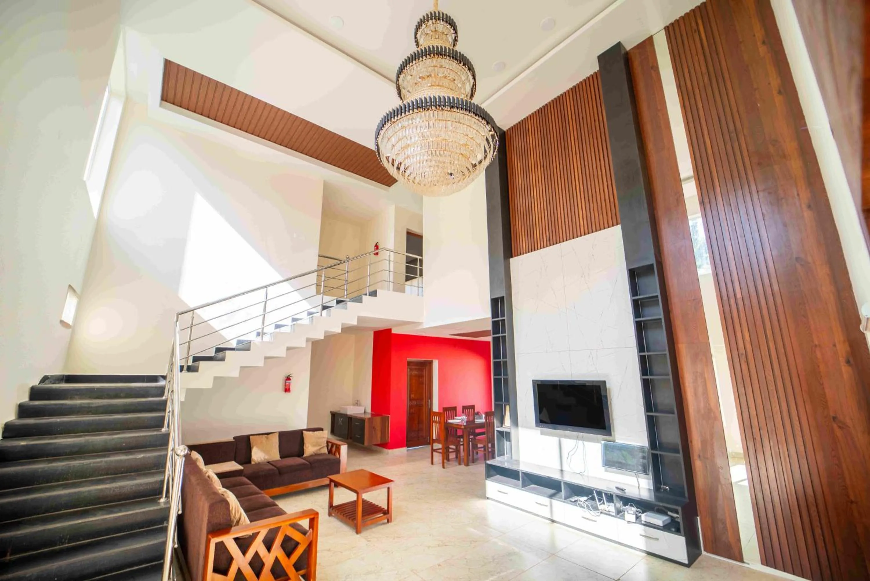 Communal lounge/ TV room in Queen's Hotel Mount garden Kodaikanal