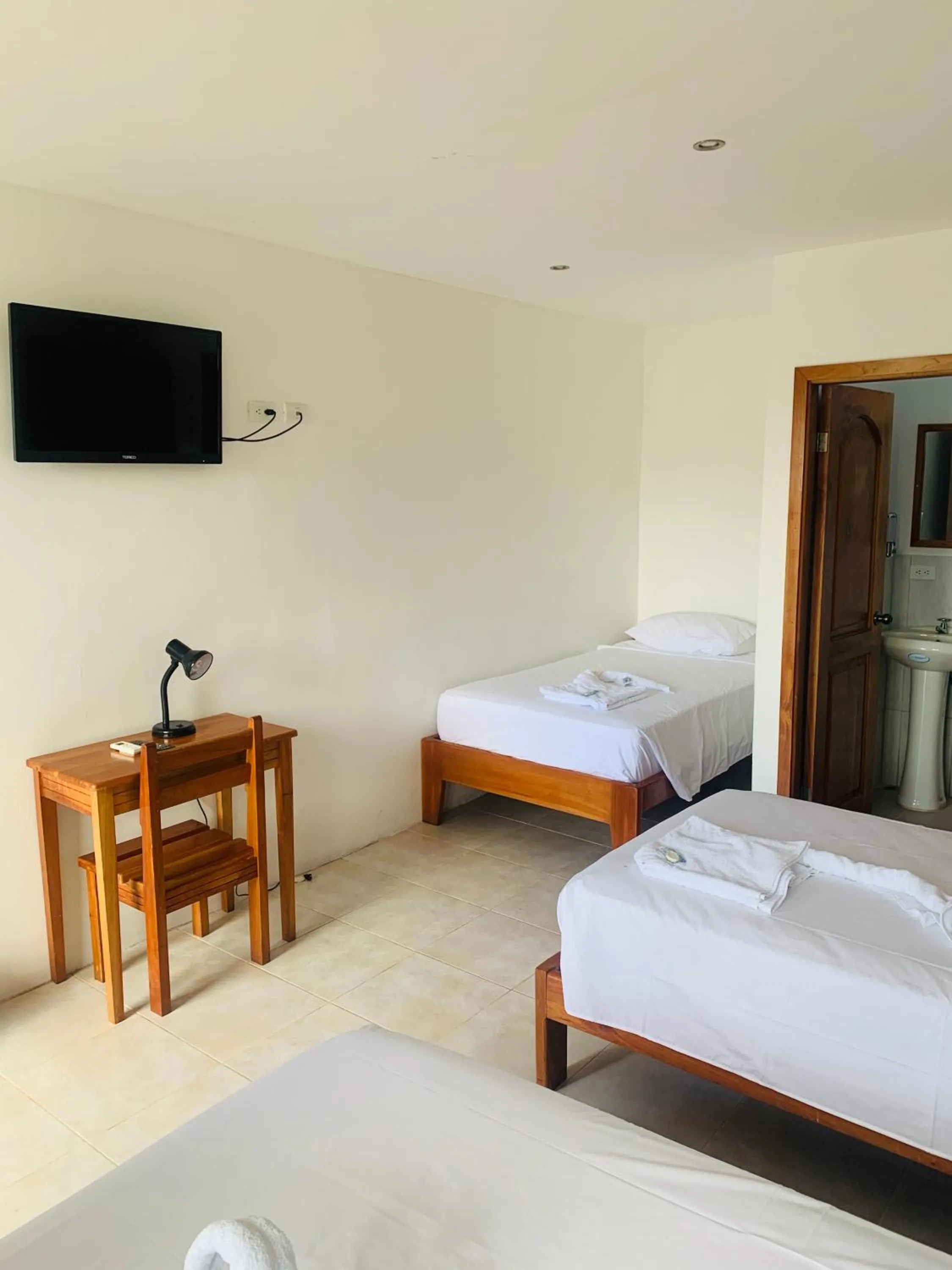 Bed in Hostal White House Galapagos