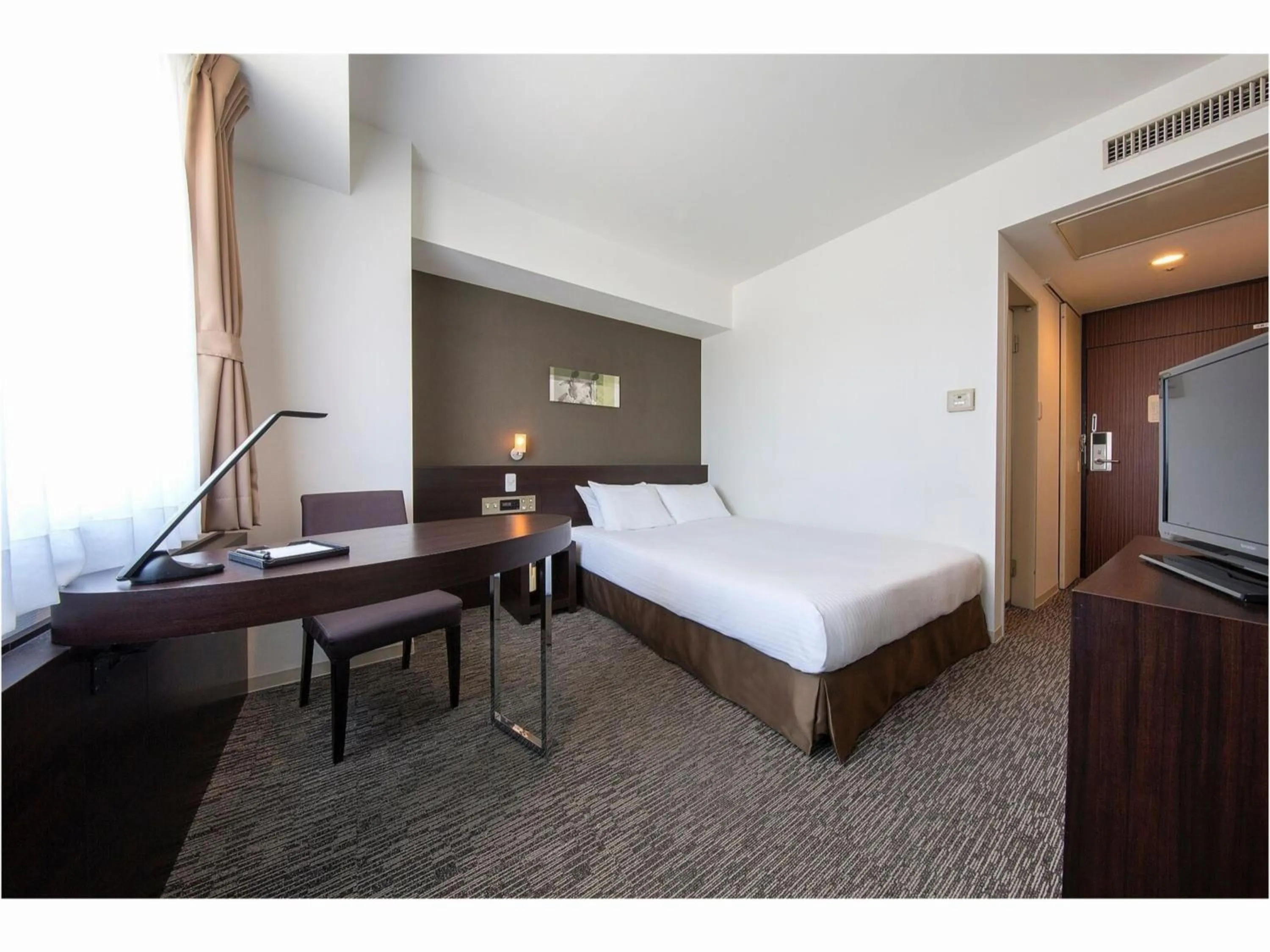 Bed in Rembrandt Hotel Tokyo-Machida