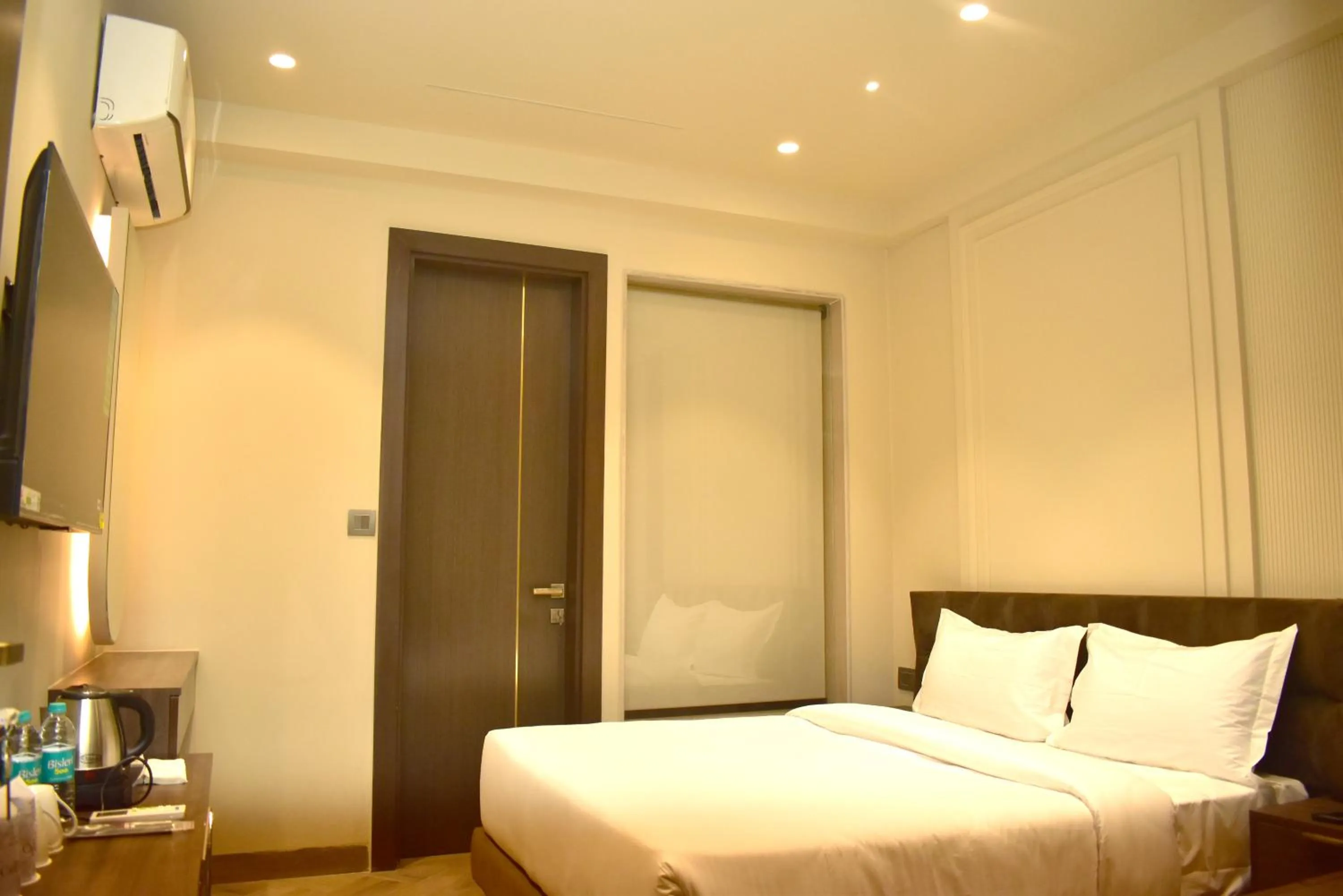 Bed in Qotel Signature Coleman Janakpuri