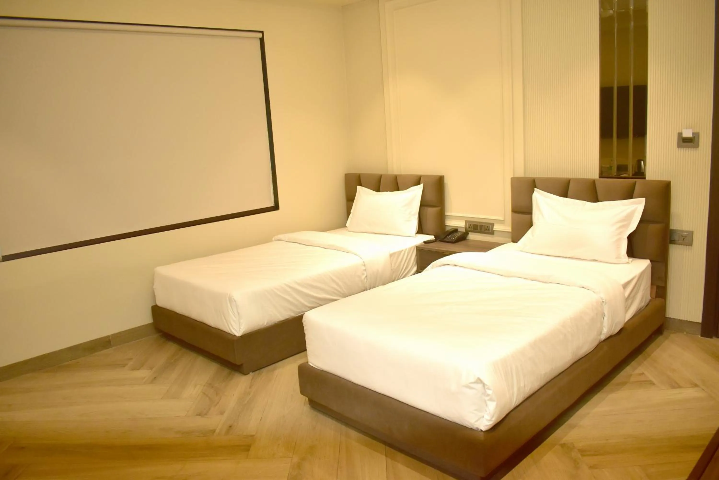Bed in Qotel Signature Coleman Janakpuri