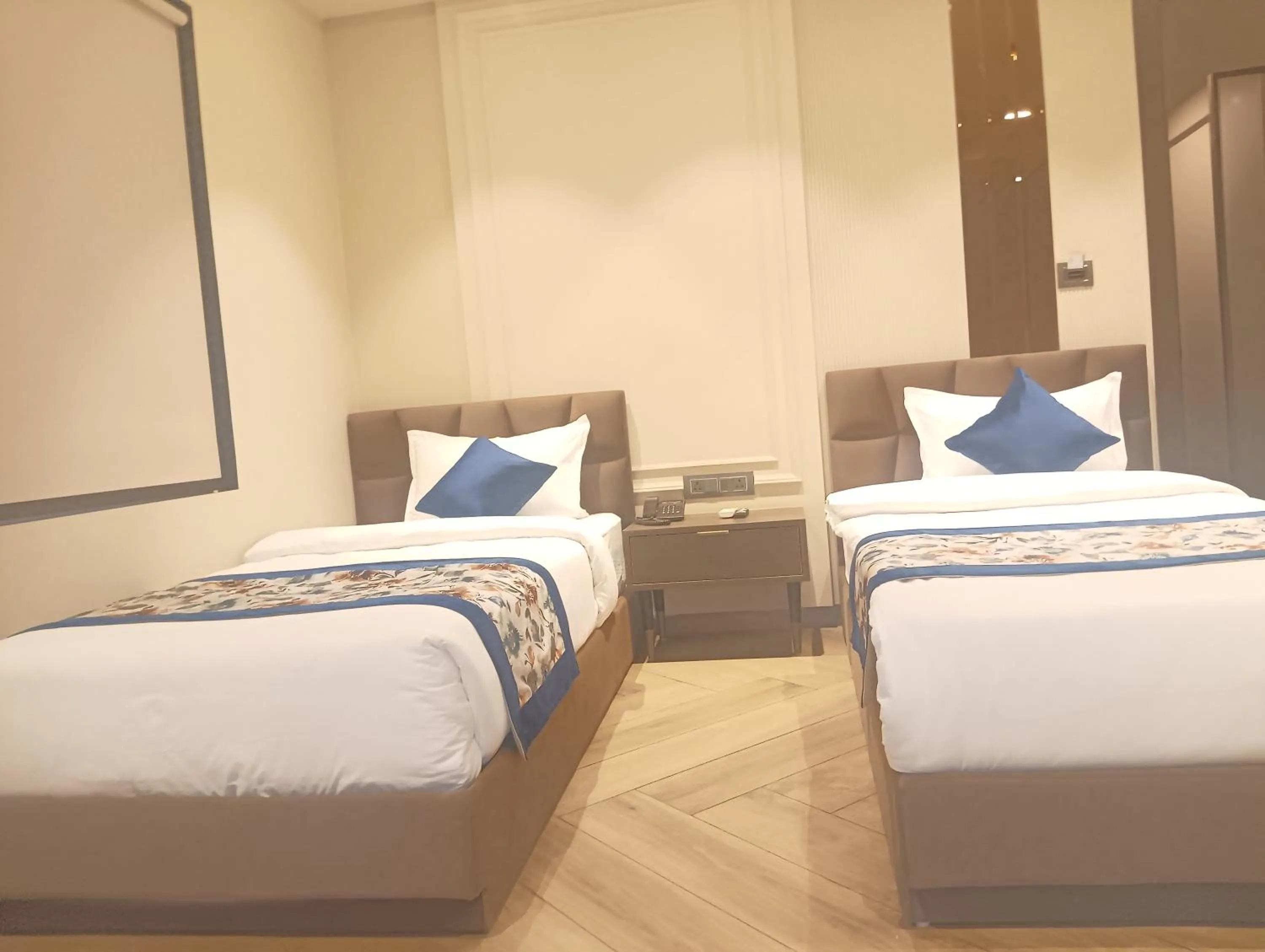Bed in Qotel Signature Coleman Janakpuri