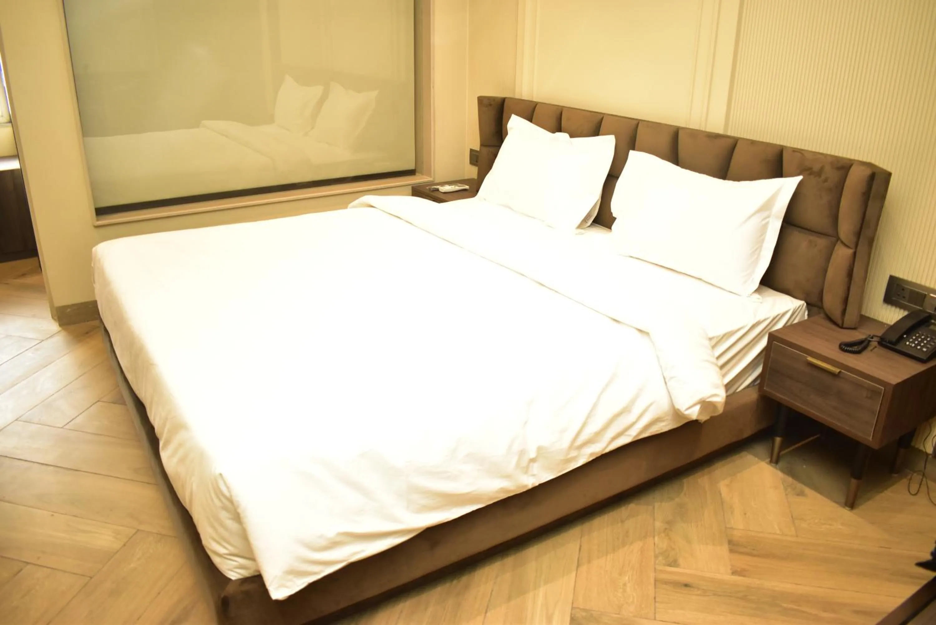Bed in Qotel Signature Coleman Janakpuri