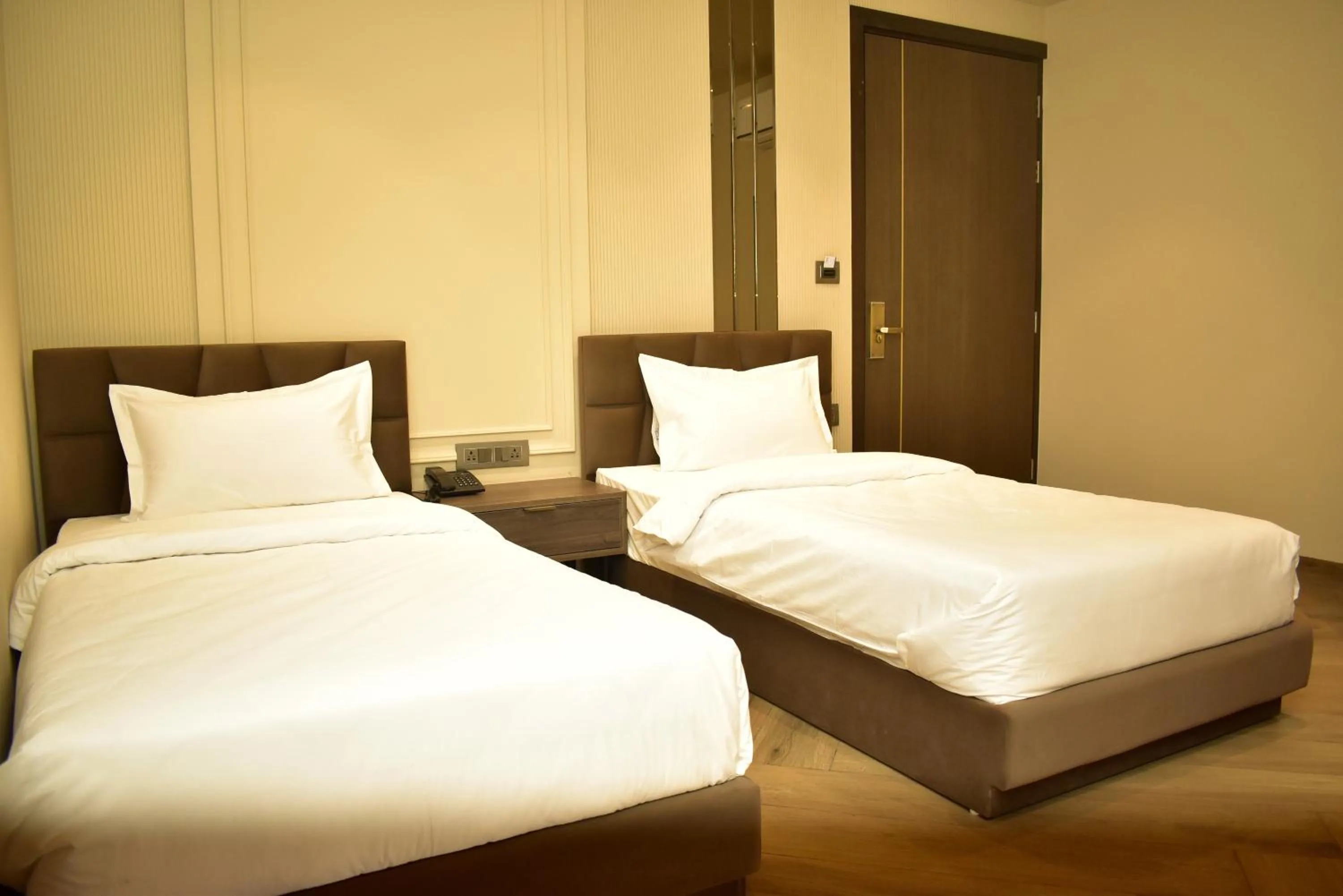 Bed in Qotel Signature Coleman Janakpuri
