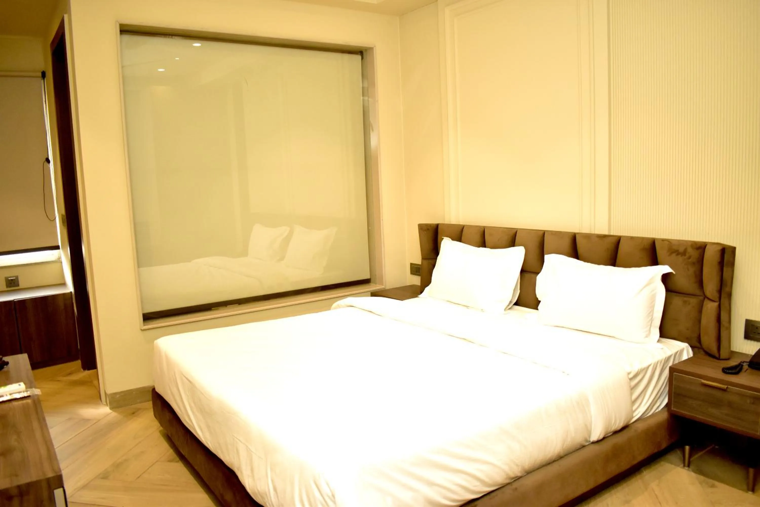 Bed in Qotel Signature Coleman Janakpuri