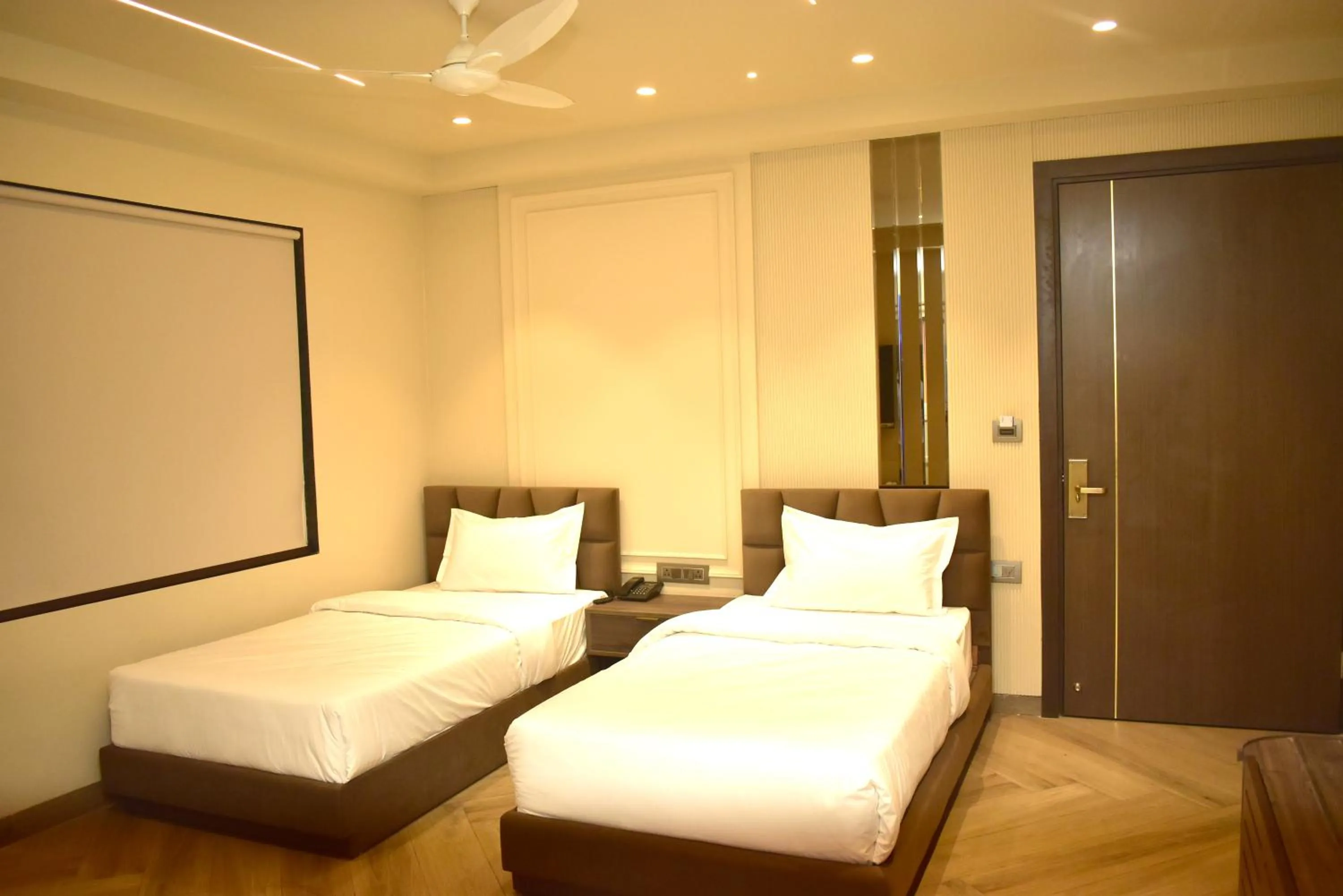 Bed in Qotel Signature Coleman Janakpuri