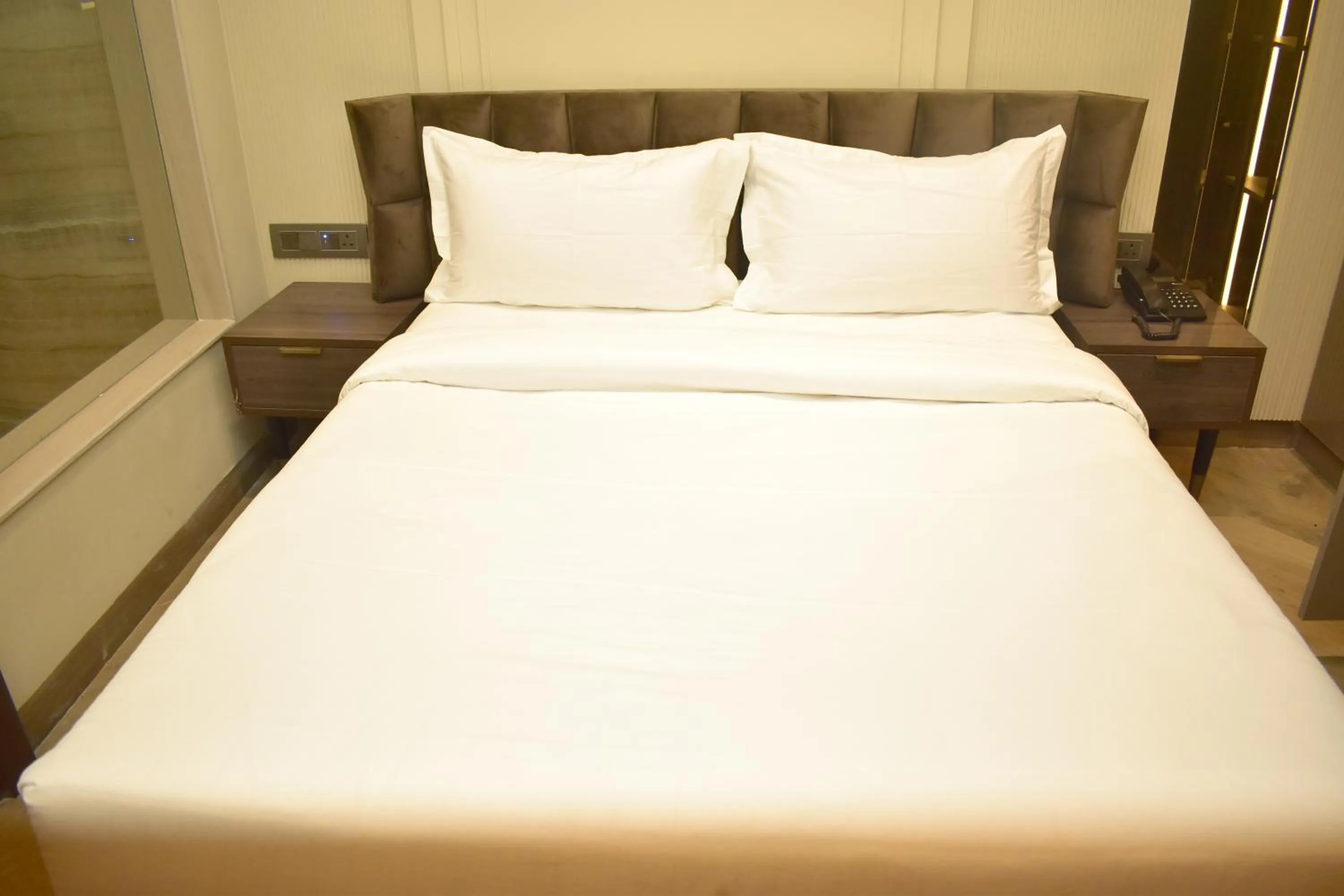 Bed in Qotel Signature Coleman Janakpuri