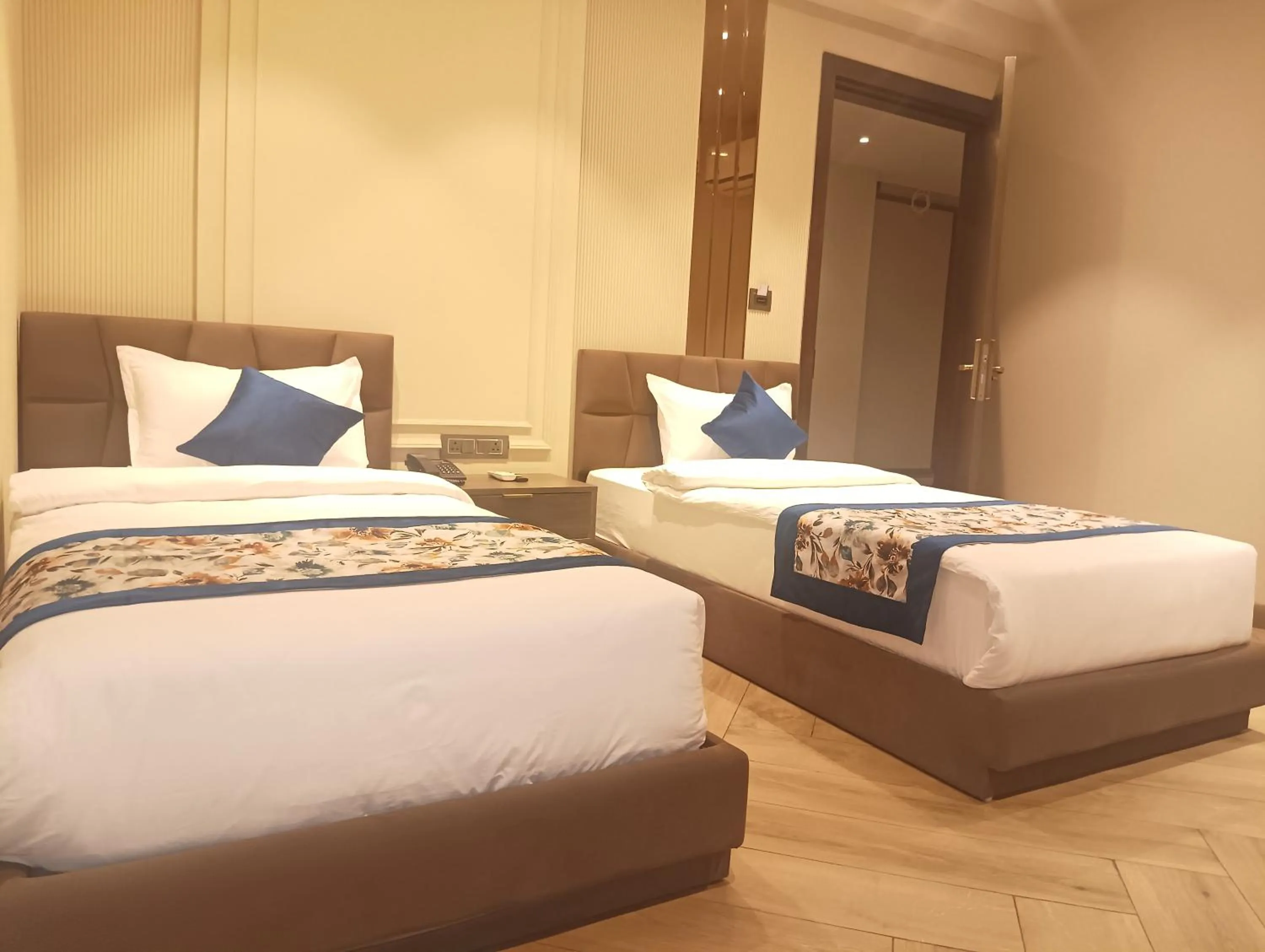 Bed in Qotel Signature Coleman Janakpuri